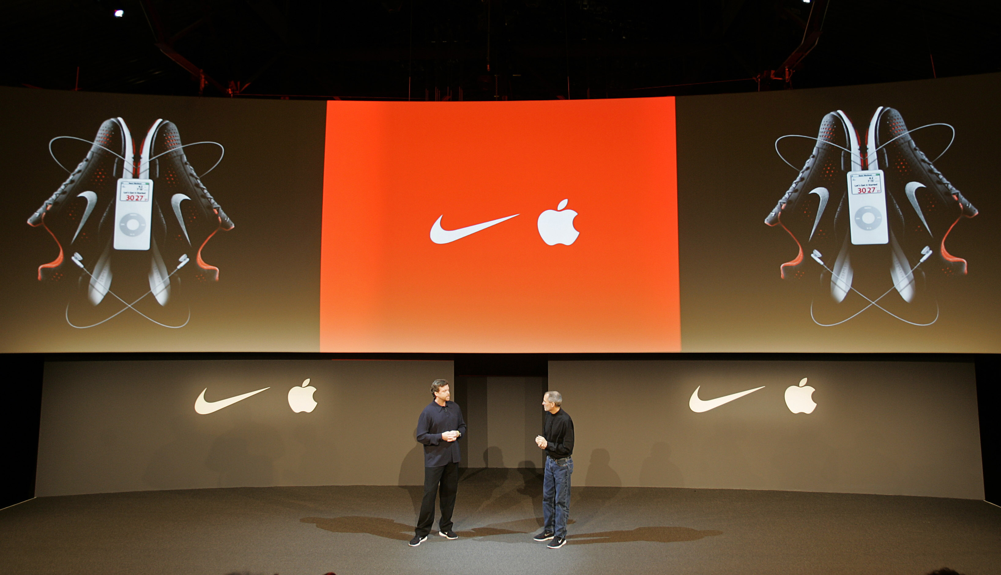Nike CEO Mark Parker and Apple CEO Steve Jobs during the unveiling of a partnership between Nike and Apple announcing the Nike+iPod, which combines the Nike Air Zoom Moire and the Apple iPod to communicate with each other via the Nike+iPod kit, using a s