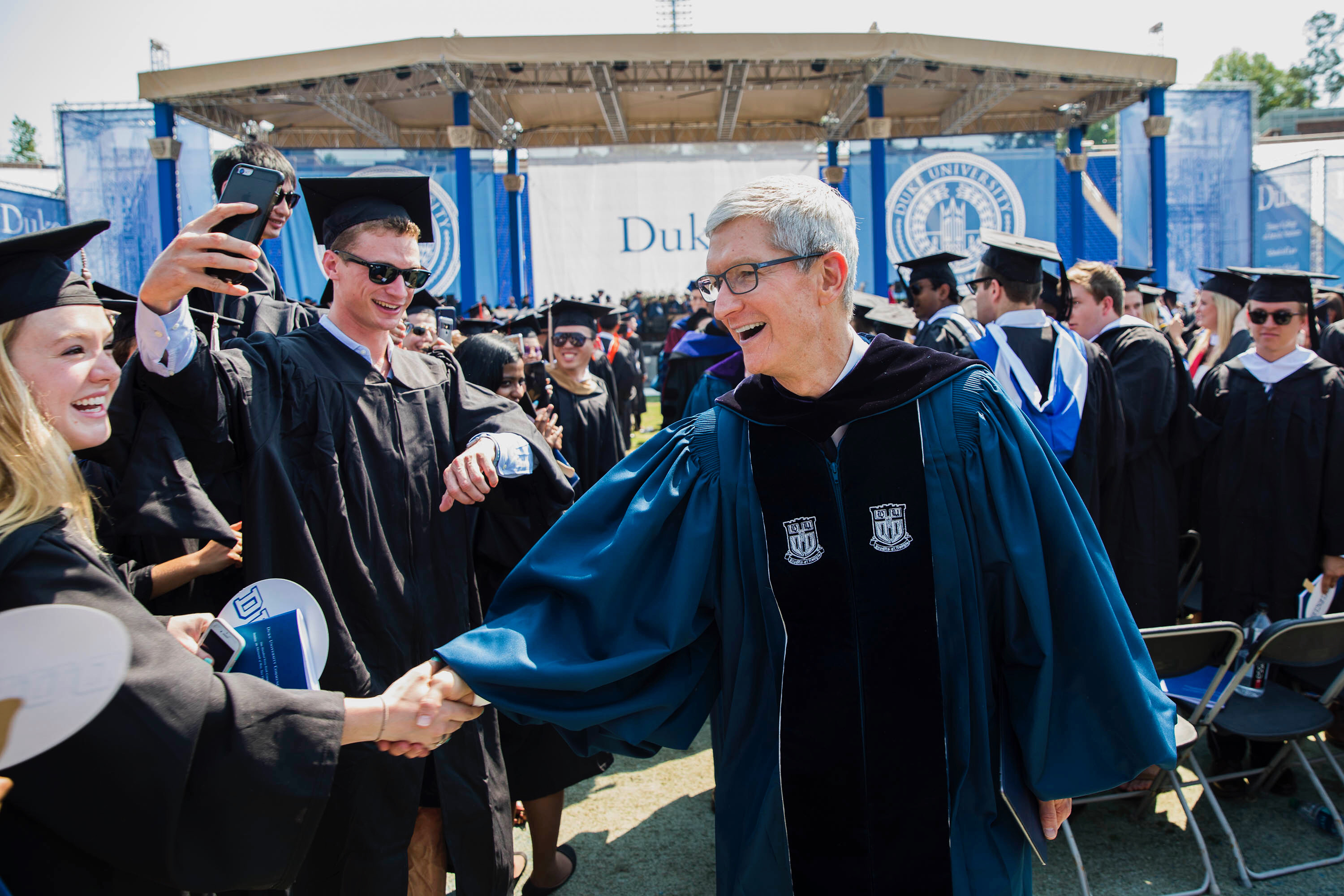 Tim Cook shaking hands with someone at Duke Commencement speech 2018