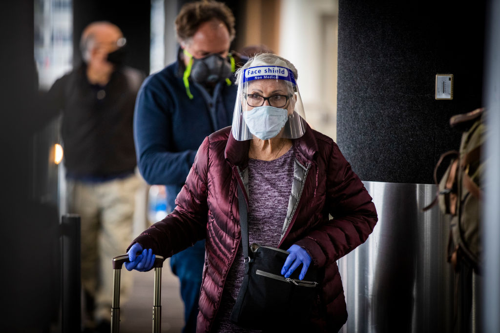 Travelers arrive for their flights at LAX as the Thanksgiving holiday getaway