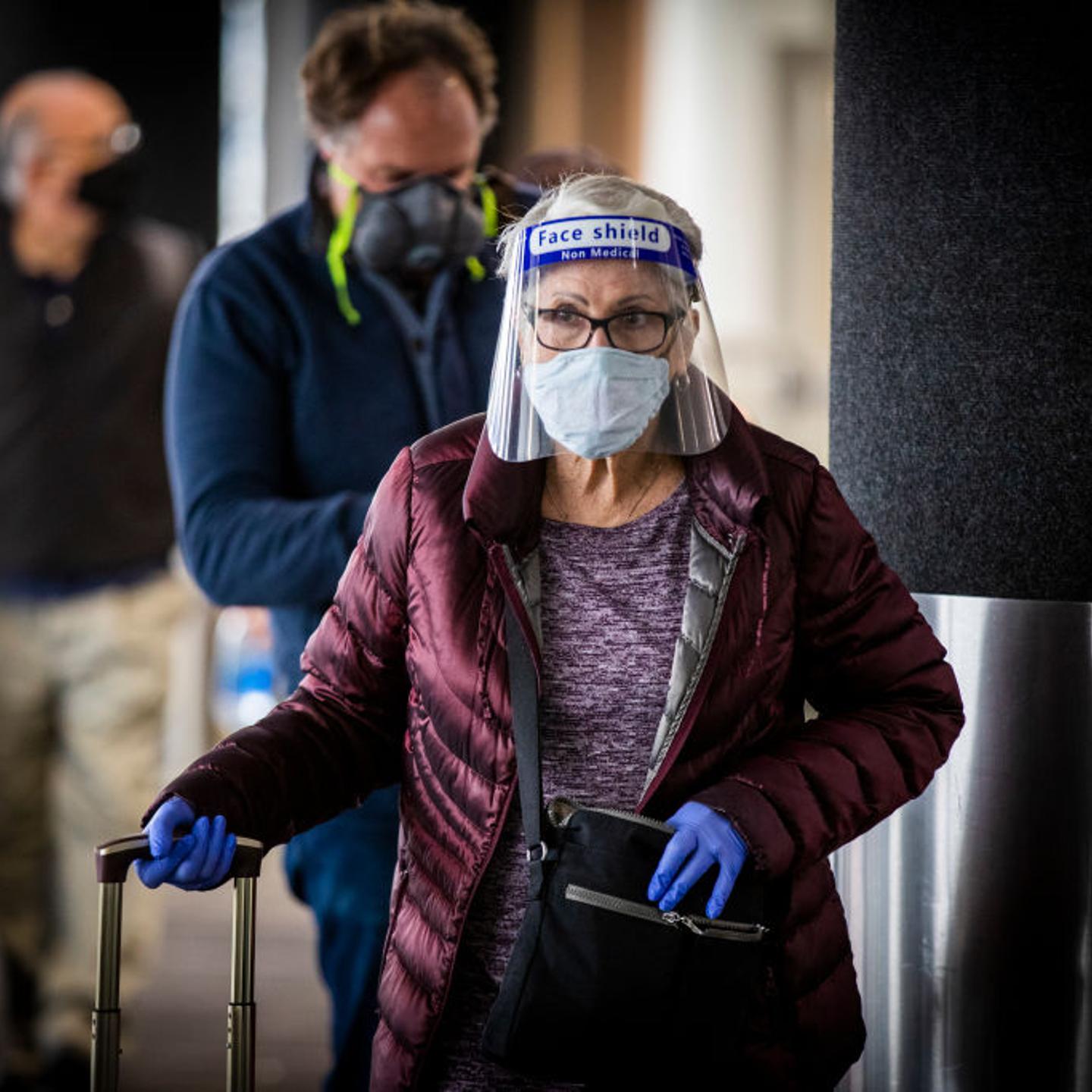 Travelers arrive for their flights at LAX as the Thanksgiving holiday getaway