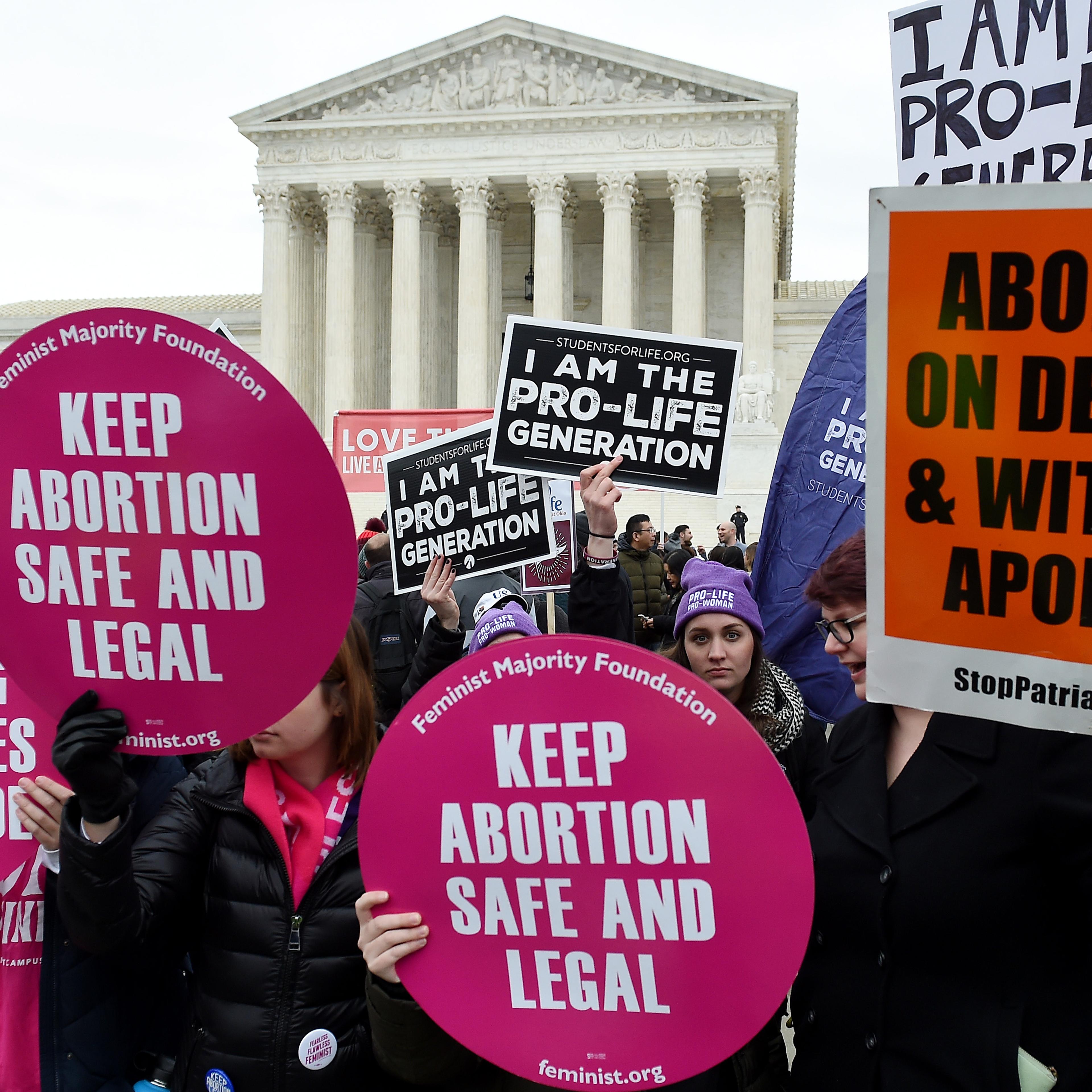 Abortion rights supporters and anti-abortion advocates demonstrate in front of the the Supreme Court during the 47th annual March for Life on Jan. 24 in Washington, D.C. in decades on the controversial subject of abortion.