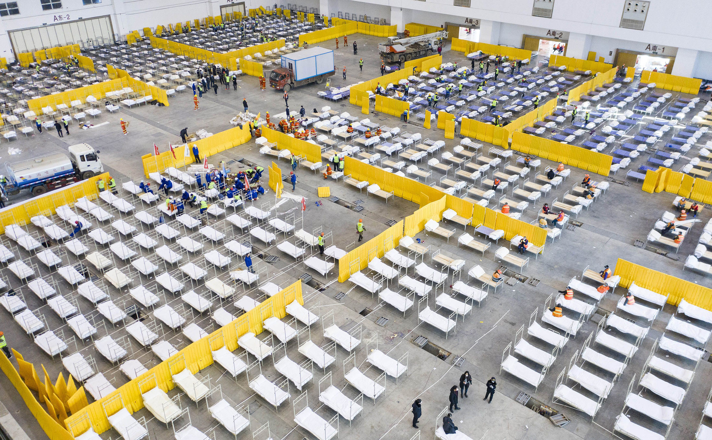 Empty beds at a Wuhan exhibition center, among several facilities retrofitted into hospitals