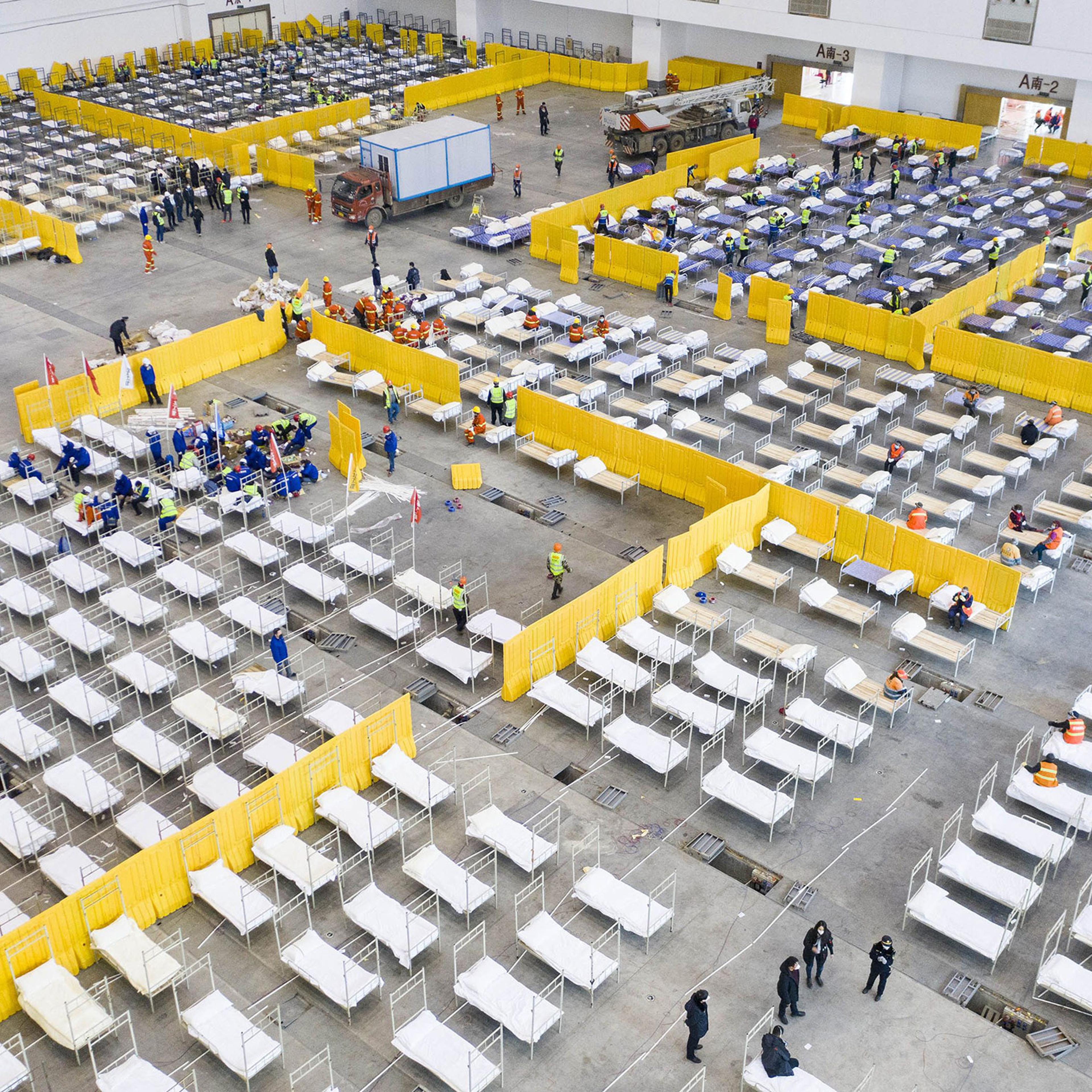 Empty beds at a Wuhan exhibition center, among several facilities retrofitted into hospitals