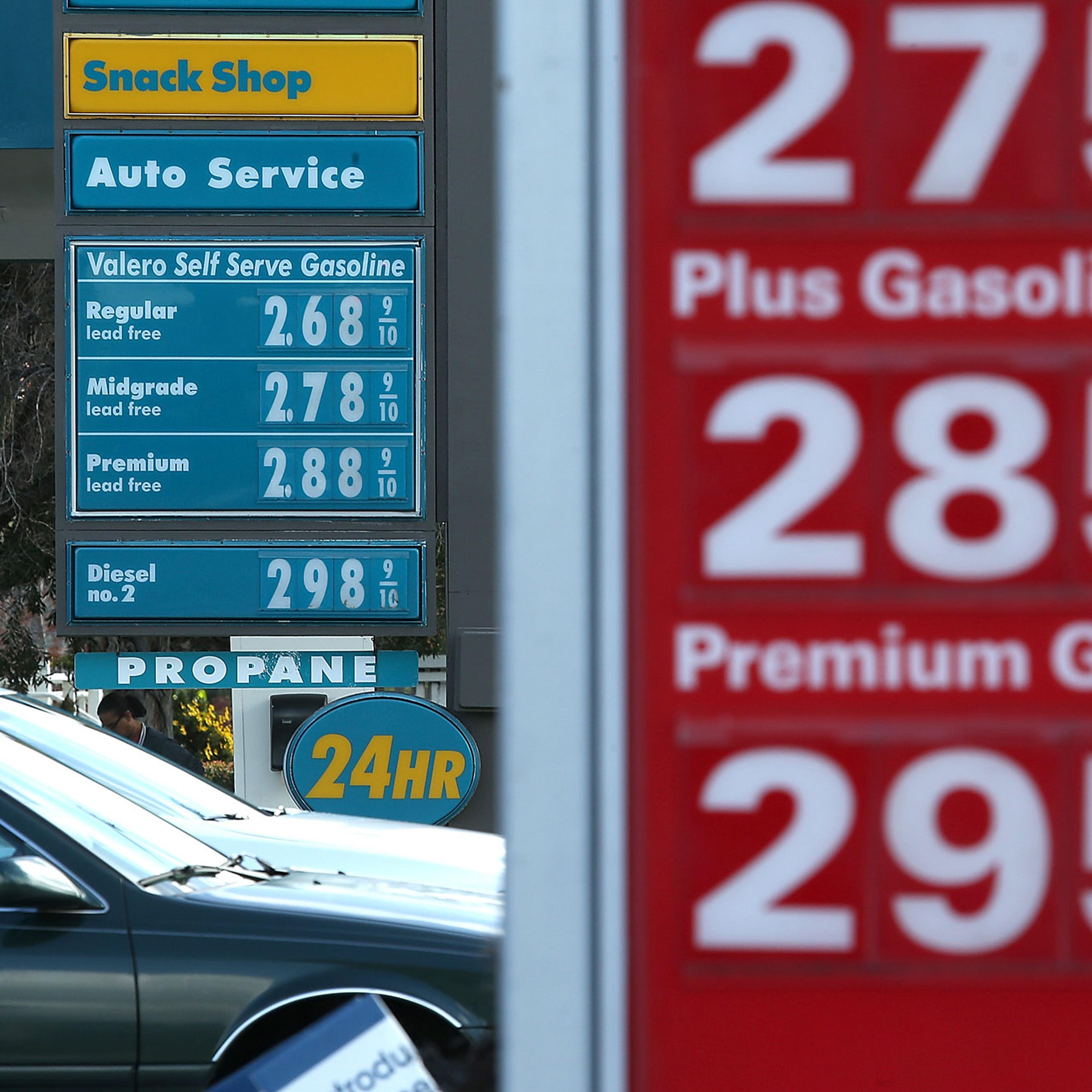 Drivers pass by gas prices that are displayed at Valero and 76 gas stations on Feb. 9, 2015 in San Rafael, Calif.