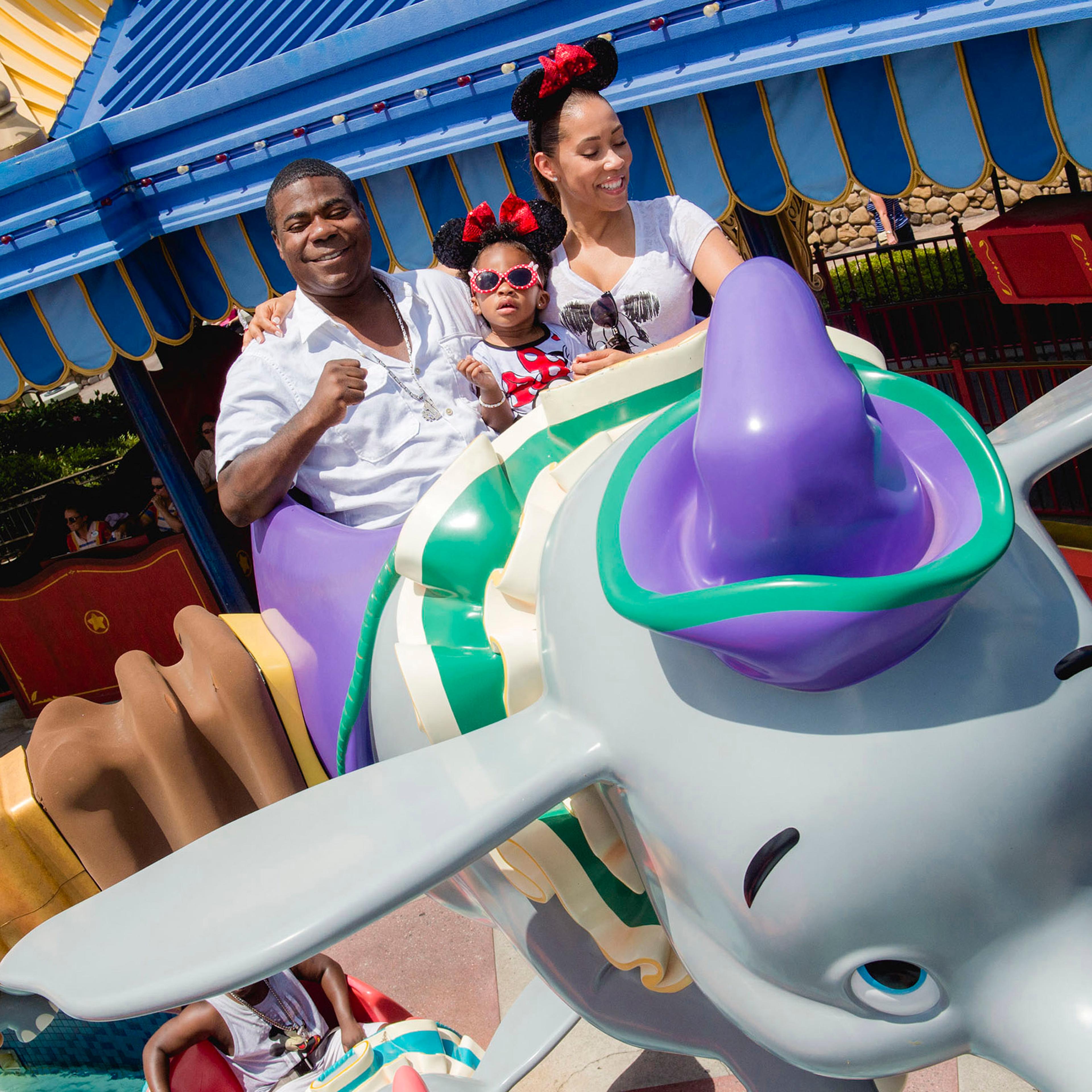 (July 2, 2015): Actor-comedian Tracy Morgan, fiancée Megan Wollover and daughter Maven Morgan, 2, take flight July 2, 2015 on Dumbo the Flying Elephant at Magic Kingdom theme park. The family celebrated Maven Morgan’s second birthday at Walt Disney Wo
