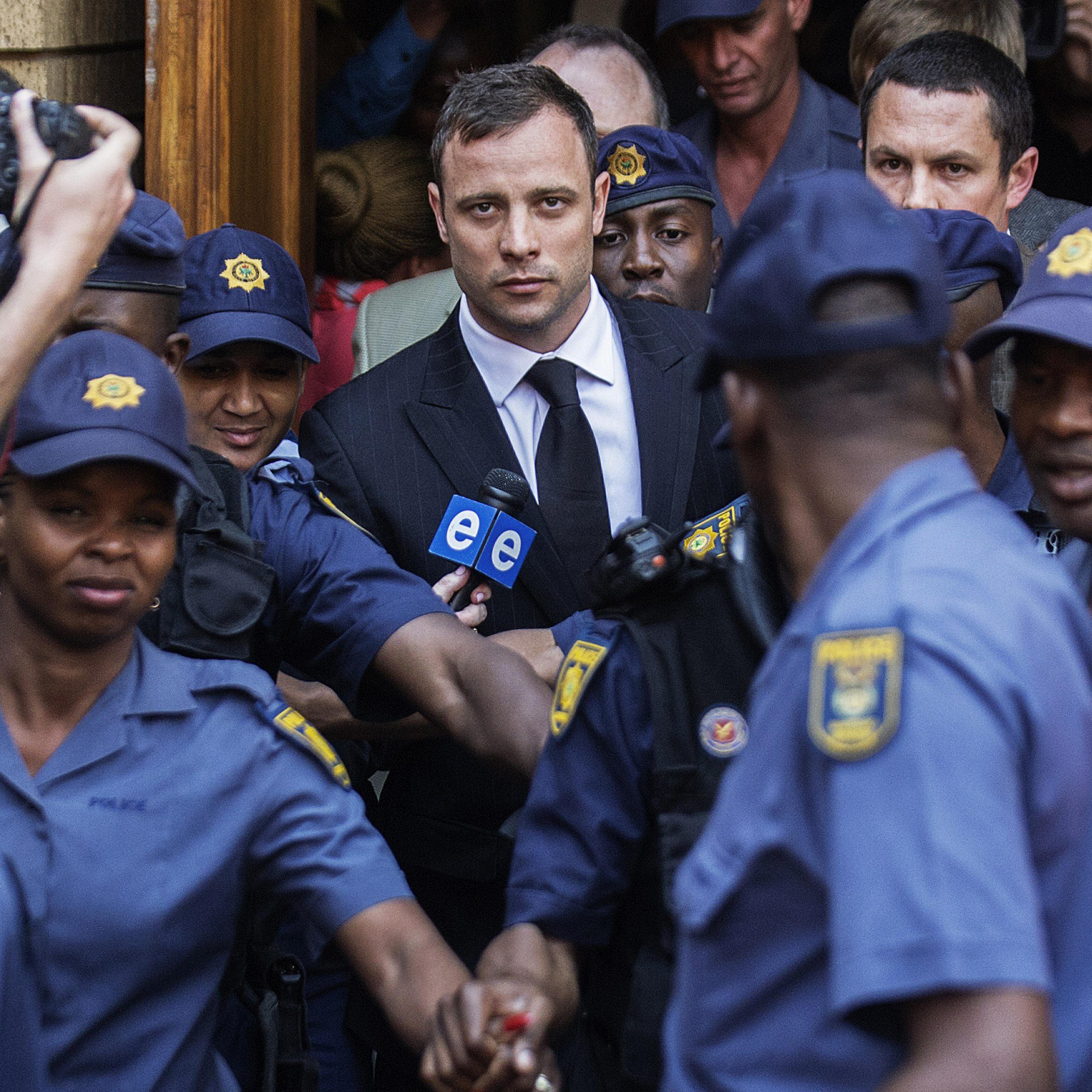 South African Paralympian athlete Oscar Pistorius leaves the High Court in Pretoria on Sept. 12, 2014 after the verdict in his murder trial where he was found guilty of culpable homicide.