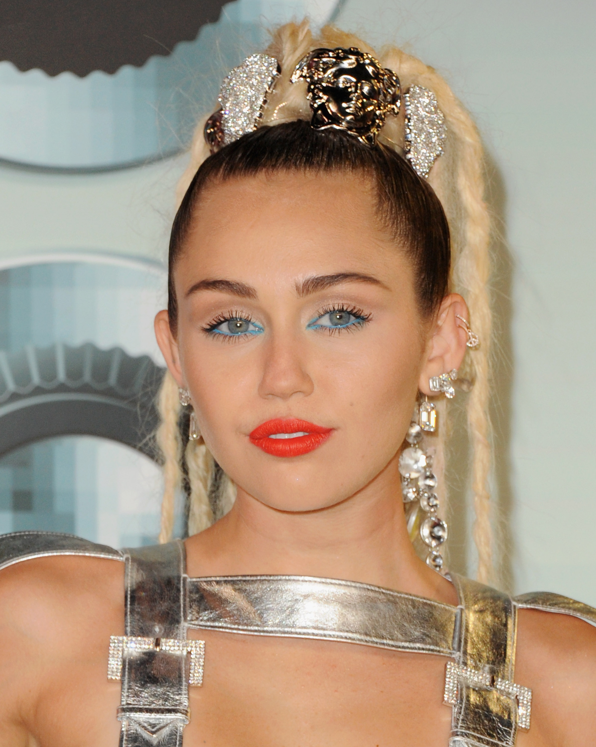 Miley Cyrus arrives at the 2015 MTV Video Music Awards in Los Angeles on Aug. 30, 2015.