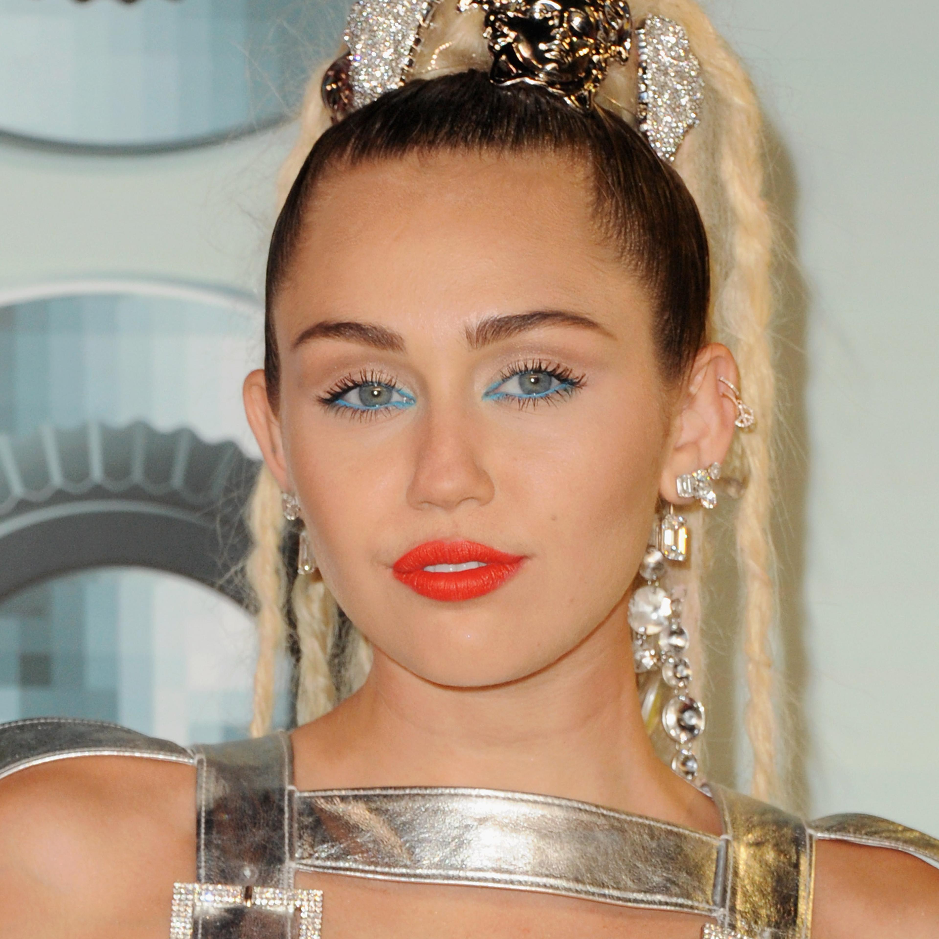 Miley Cyrus arrives at the 2015 MTV Video Music Awards in Los Angeles on Aug. 30, 2015.