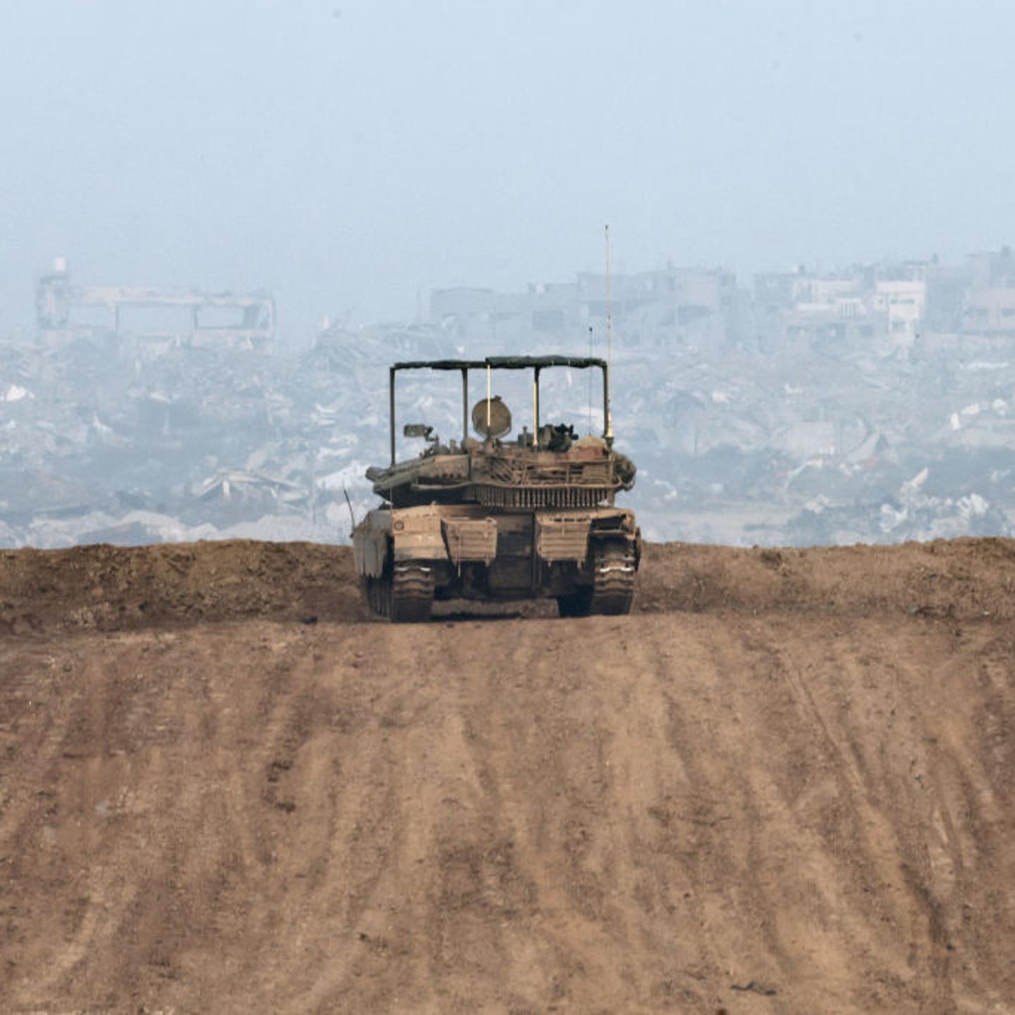 Israeli army tank stationed on a hill overlooking northern Gaza