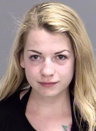 Miranda Kay Rader was arrested for Driving While Intoxicated (DWI) after she collided with a parked patrol car when taking a topless selfie Thursday evening, the police department for Bryan, Texas, reports