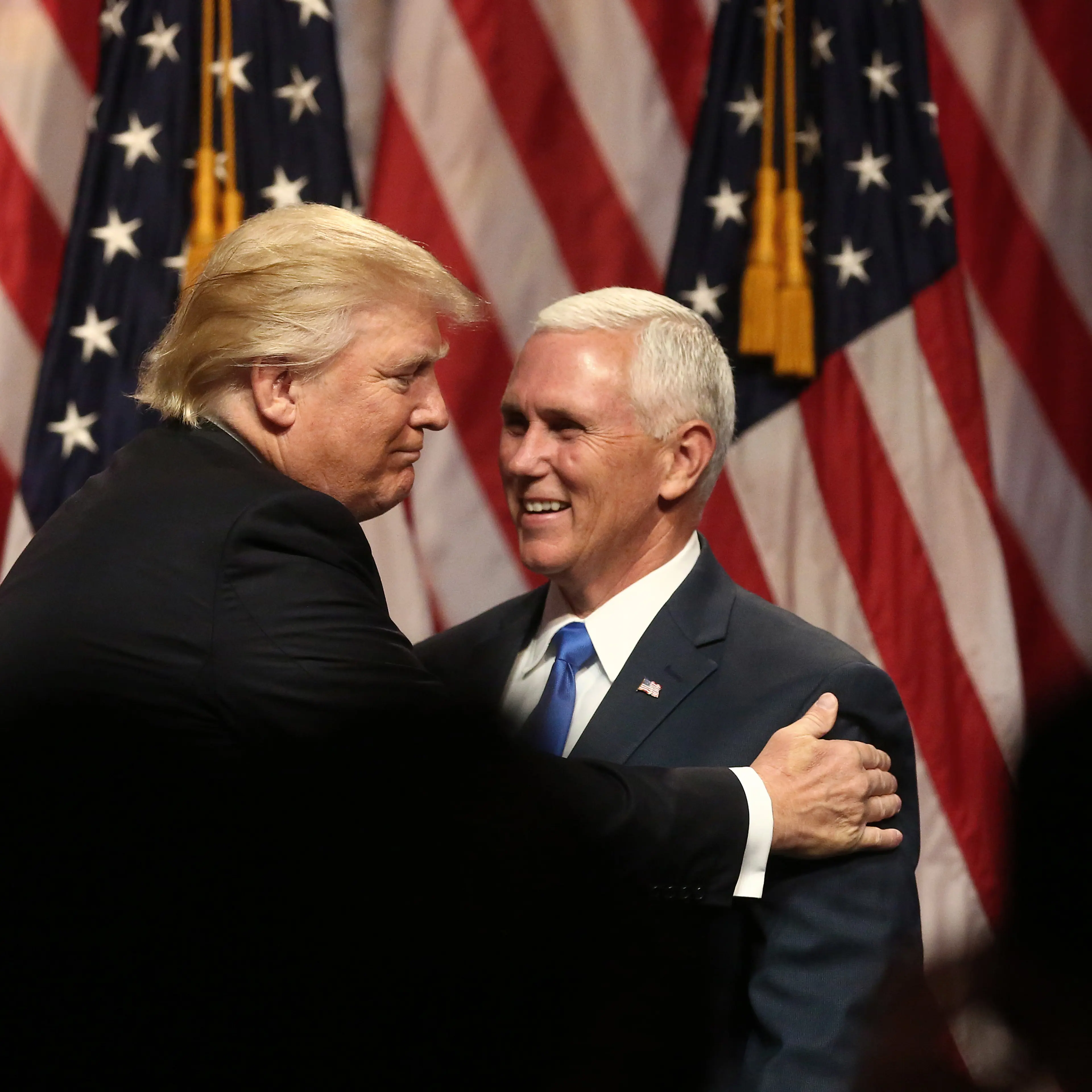 Donald Trump, presumptive Republican presidential nominee, greets Mike Pence, governor of Indiana and presumptive Republican vice presidential nominee, on stage during a campaign event in New York City, on July 16, 2016.