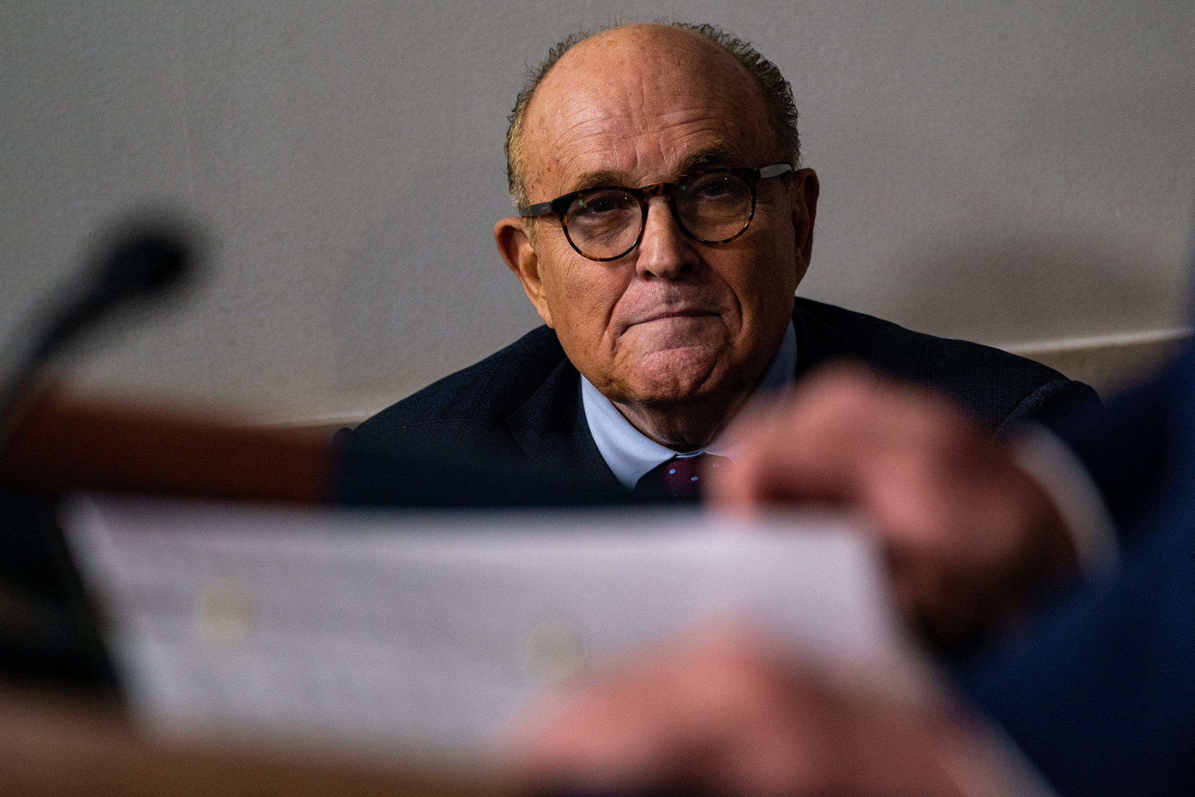 Rudy Giuliani listens as President Trump speaks during a news briefing at the White House in Washington, D.C., on Sept. 27, 2020.