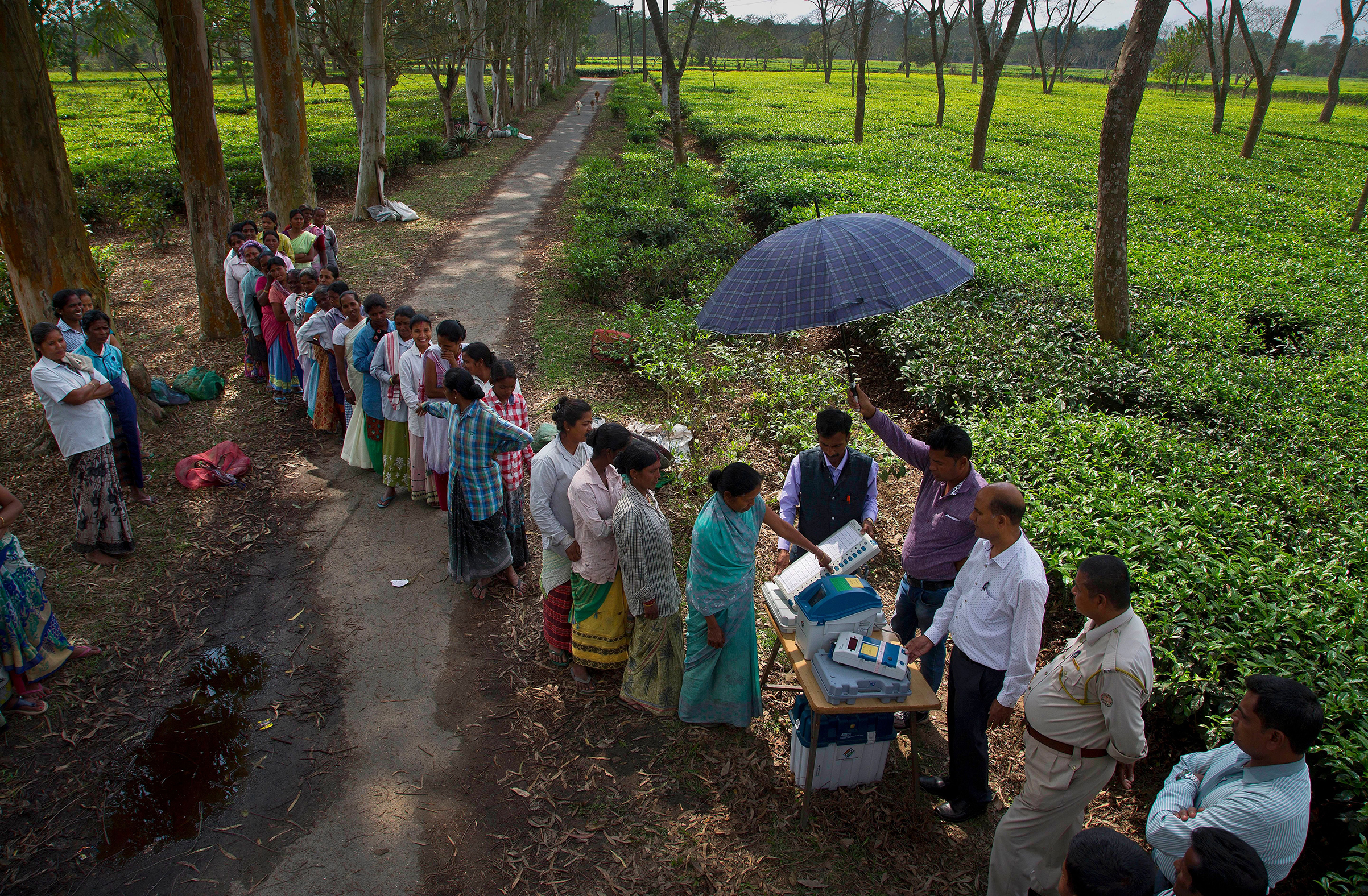 A woman in Jorhat, India, casts her vote on a demo VVPAT vending machine, which allows voters to check that their votes are being cast as intended. The system will be used in the upcoming national election.