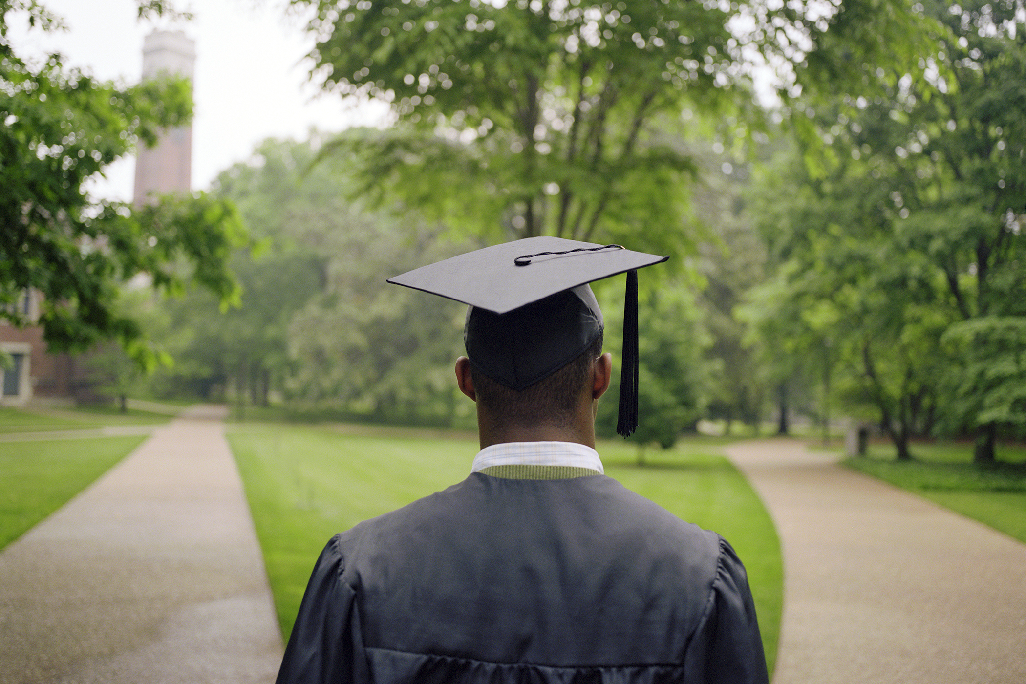 college graduate student staring at two paths