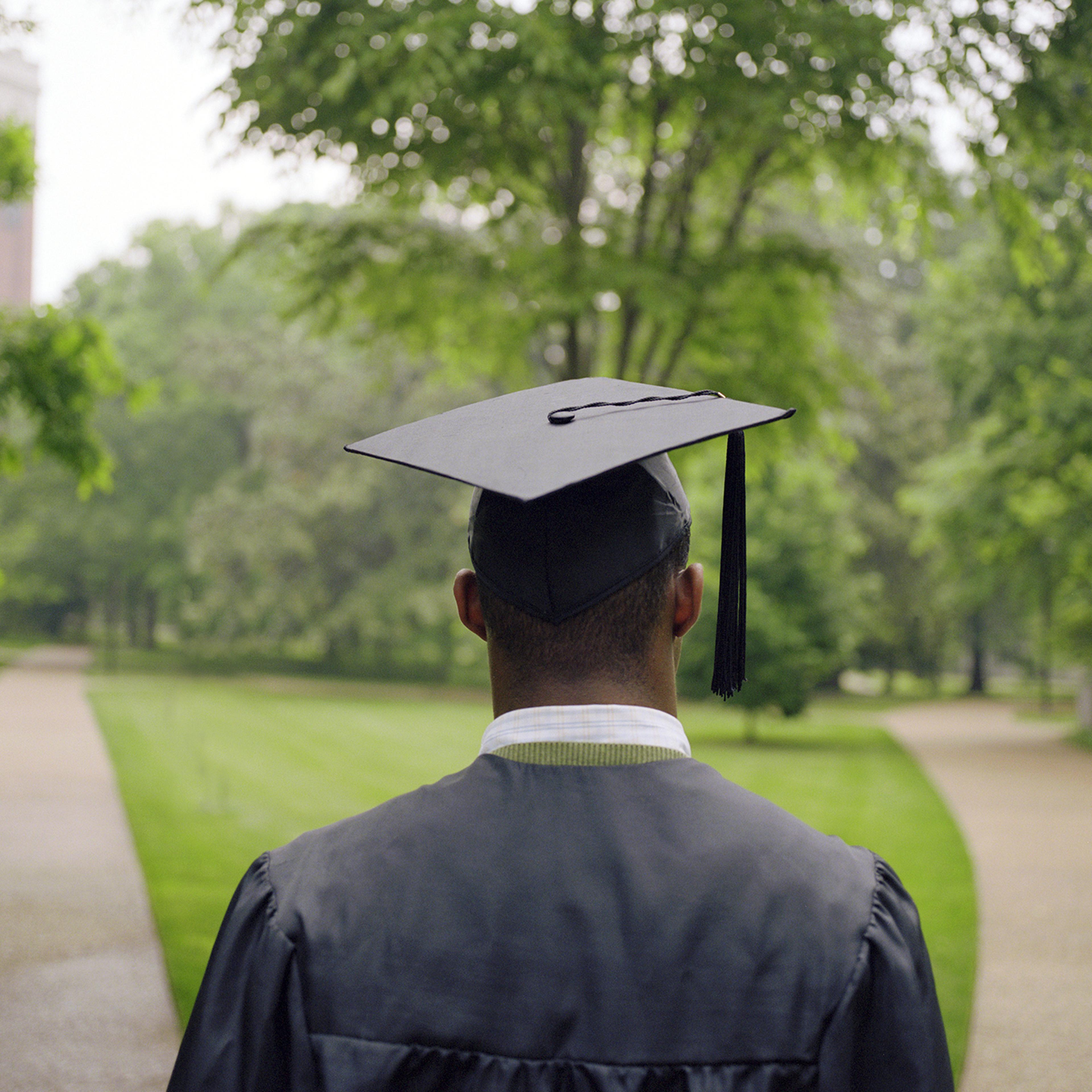 college graduate student staring at two paths