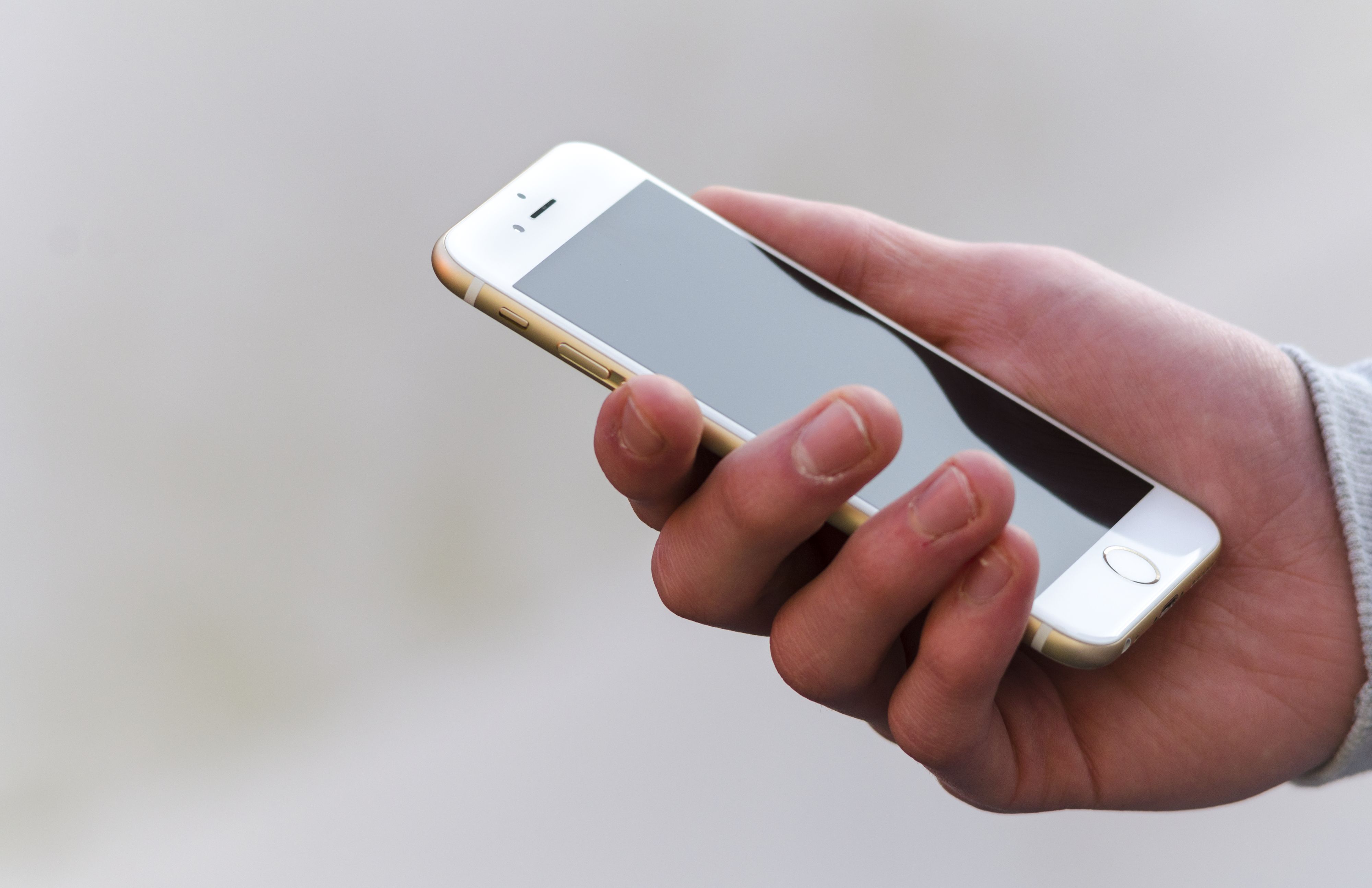 Person Holding Apple iPhone 6