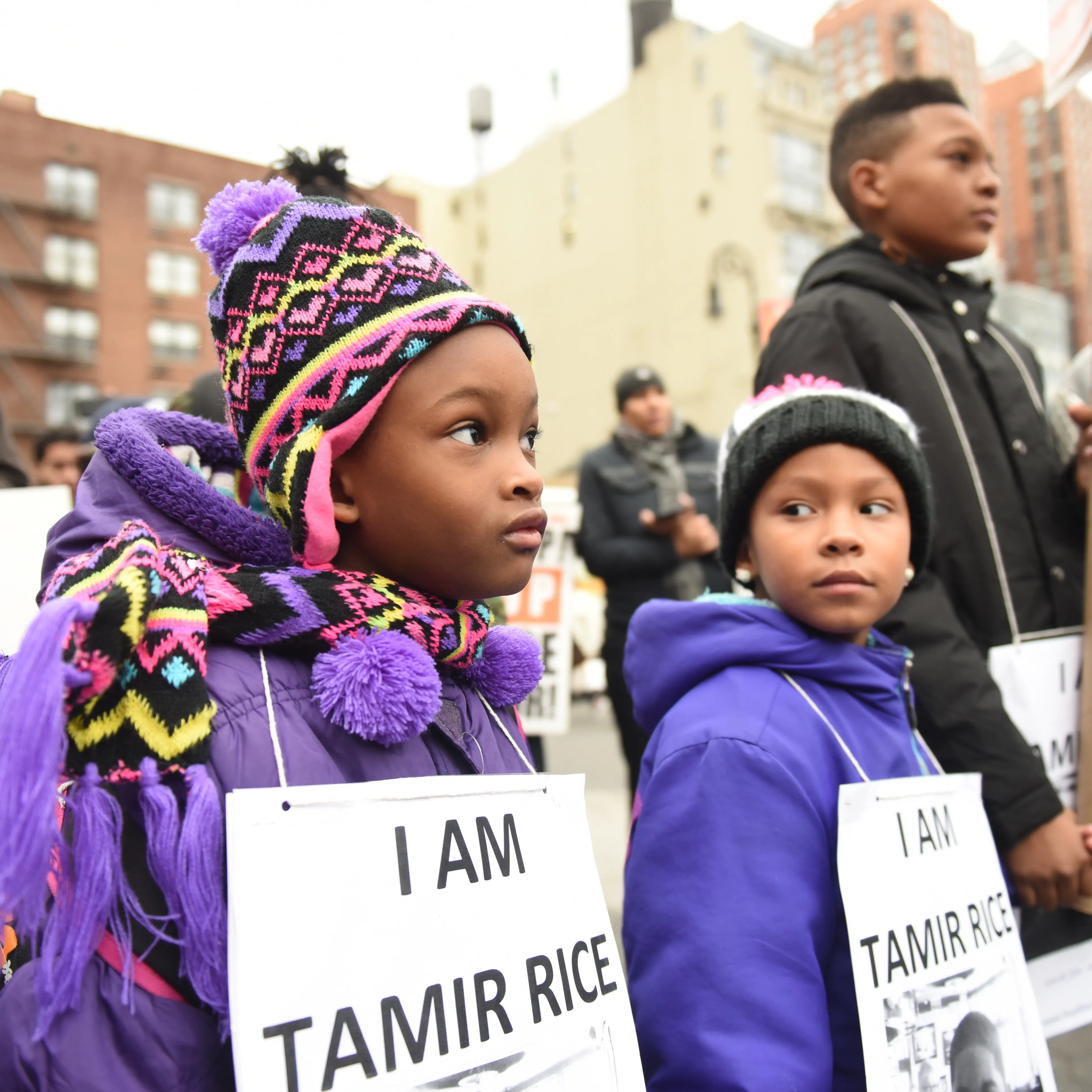 Kids with Tamir Rice signs. Stop Mass Incarcerations Network