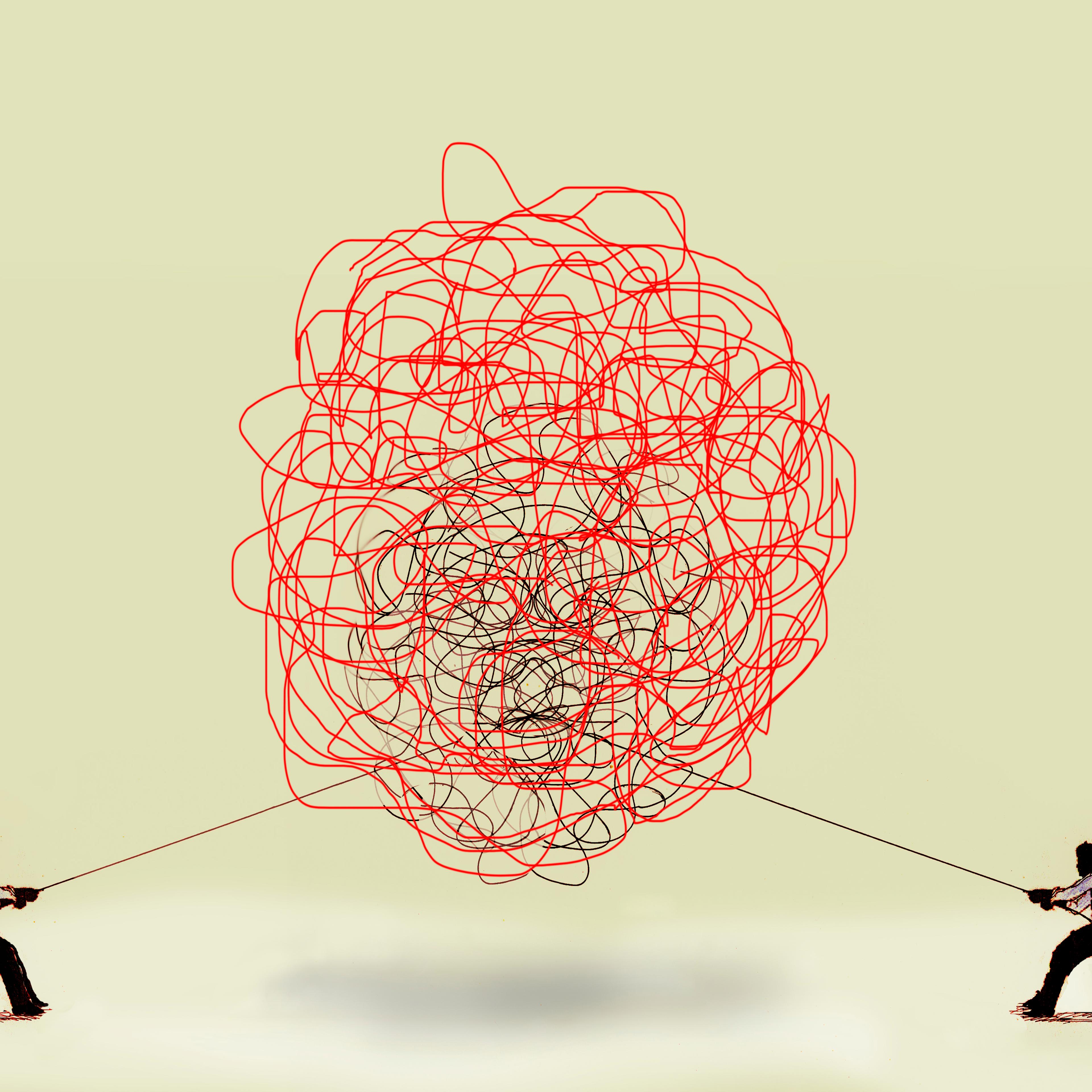 Two men pulling at tangled rope in opposite directions