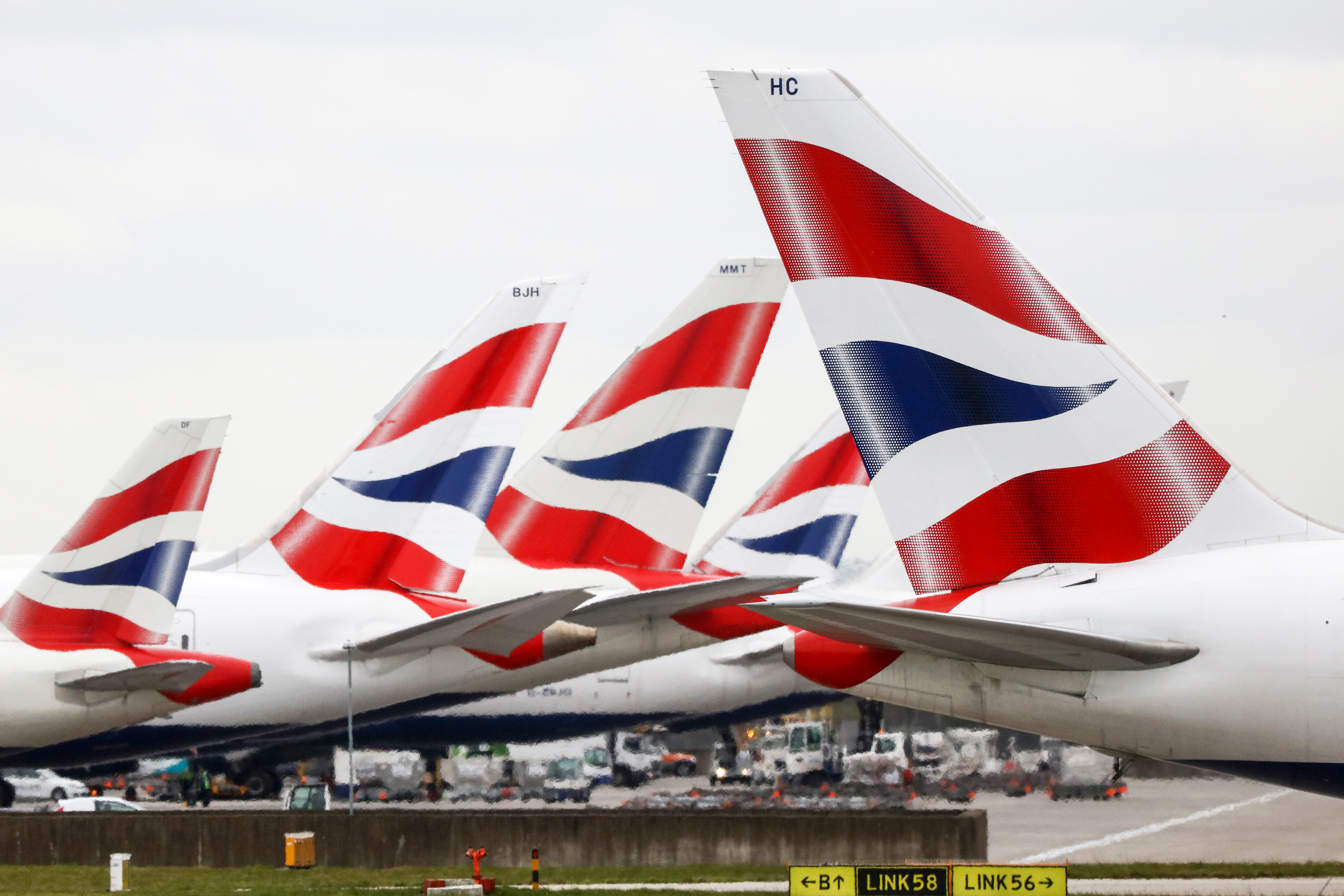 Flights Operated By British Airways Carry Passengers At Heathrow Airport