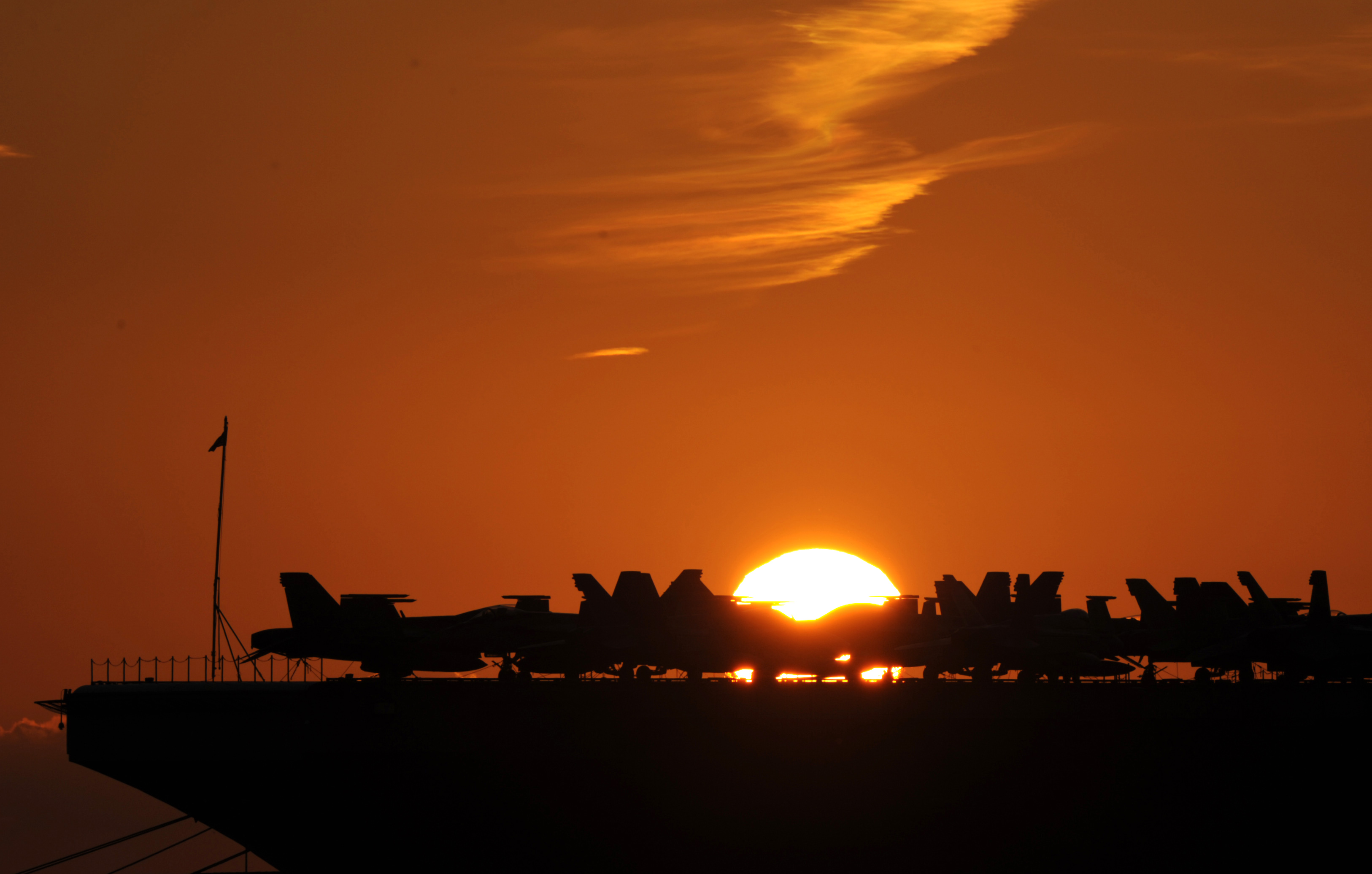 Planes are parked on the deck of the USS