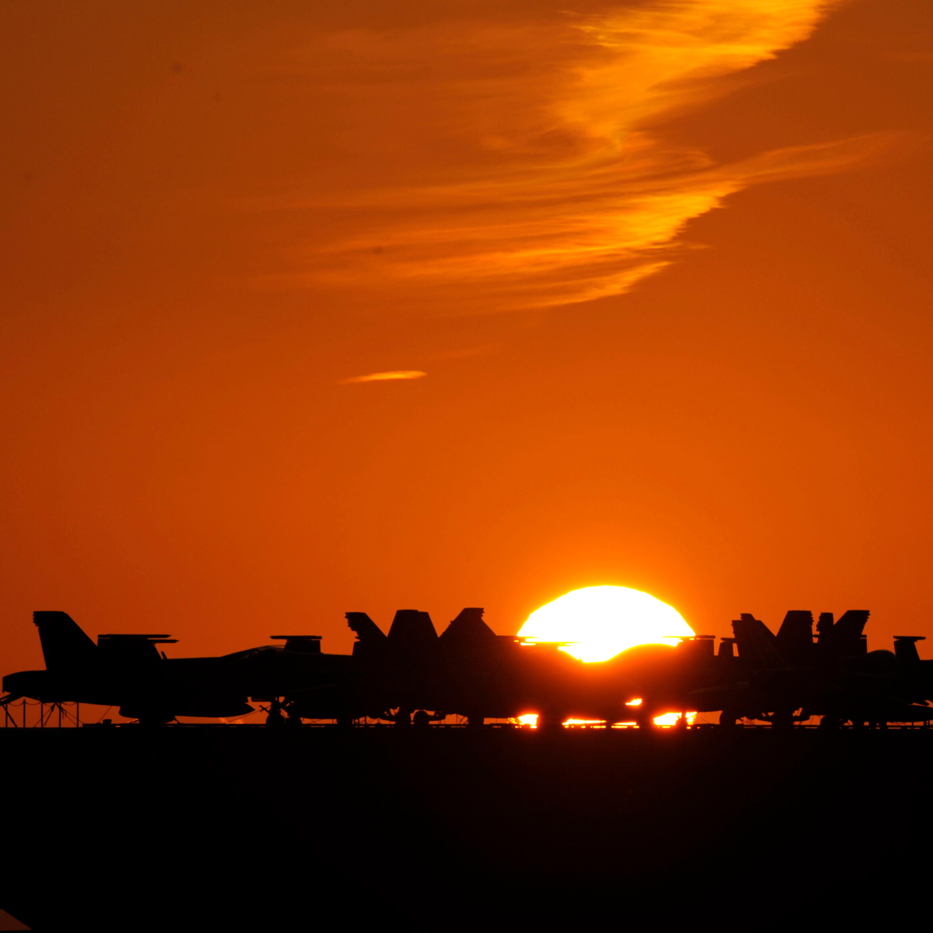 Planes are parked on the deck of the USS