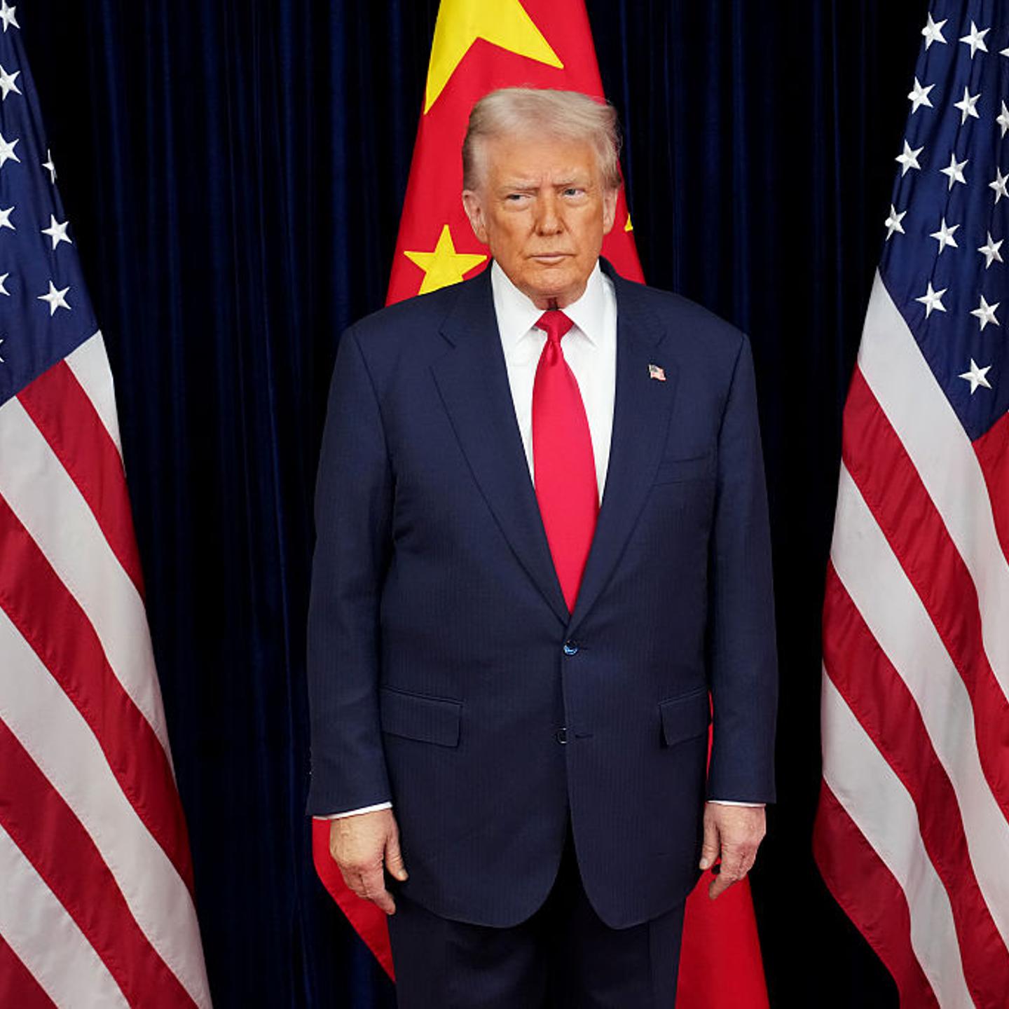 U.S. President Donald Trump prepares to greet Chinese President Xi Jinping ahead of a bilateral meeting at Gimhae Air Base in South Korea, on Oct. 30, 2025.