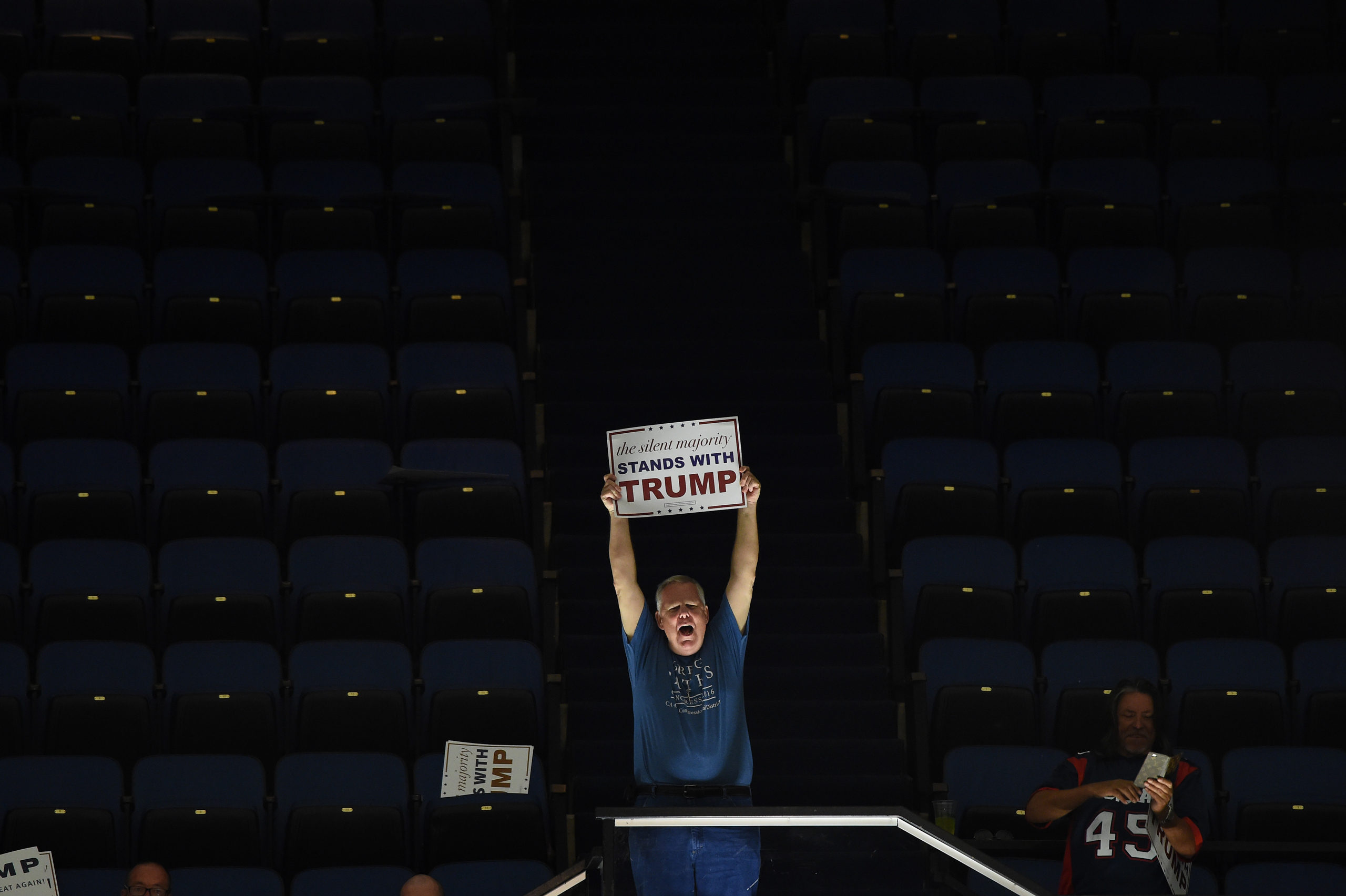 A supporter of the presumptive Republican presidential candidate Donald Trump holds a sign at a campaign rally, May 25, 2016 in Anaheim, California. / AFP / ROBYN BECK (Photo credit should read ROBYN BECK/AFP/Getty Images)