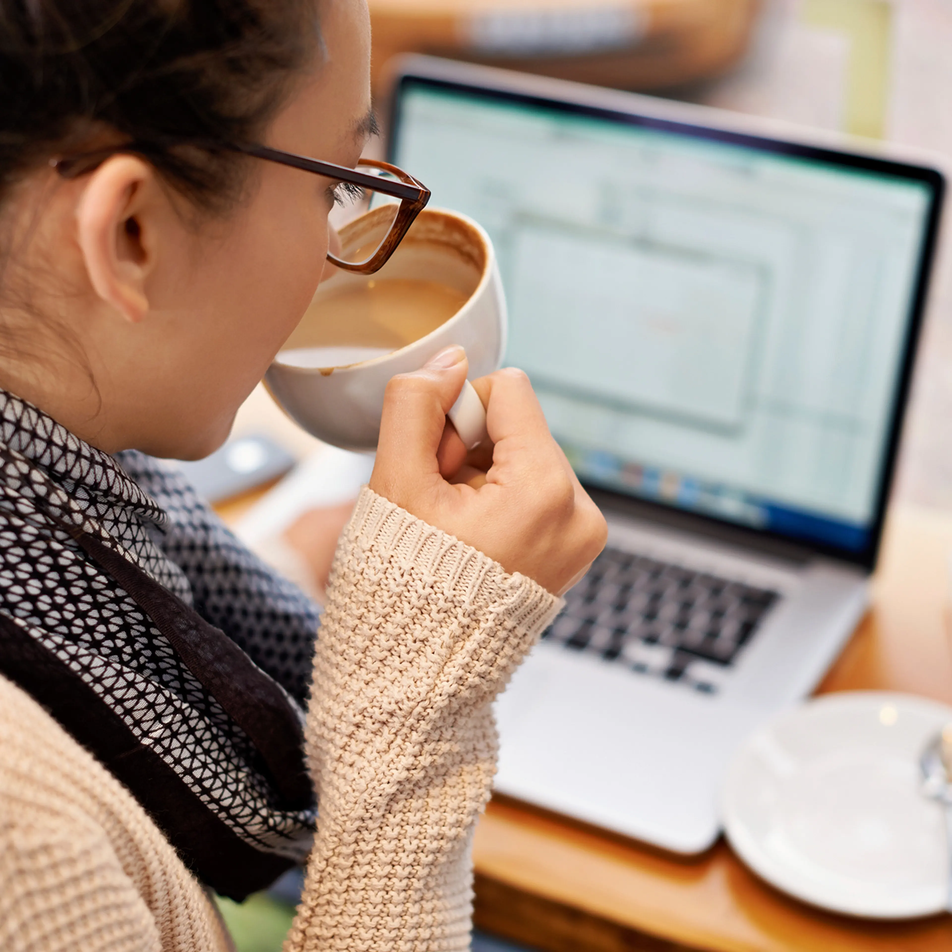 reading email on laptop