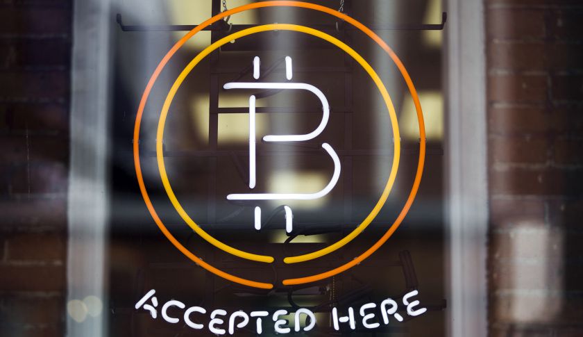 A Bitcoin sign is seen in a window in Toronto