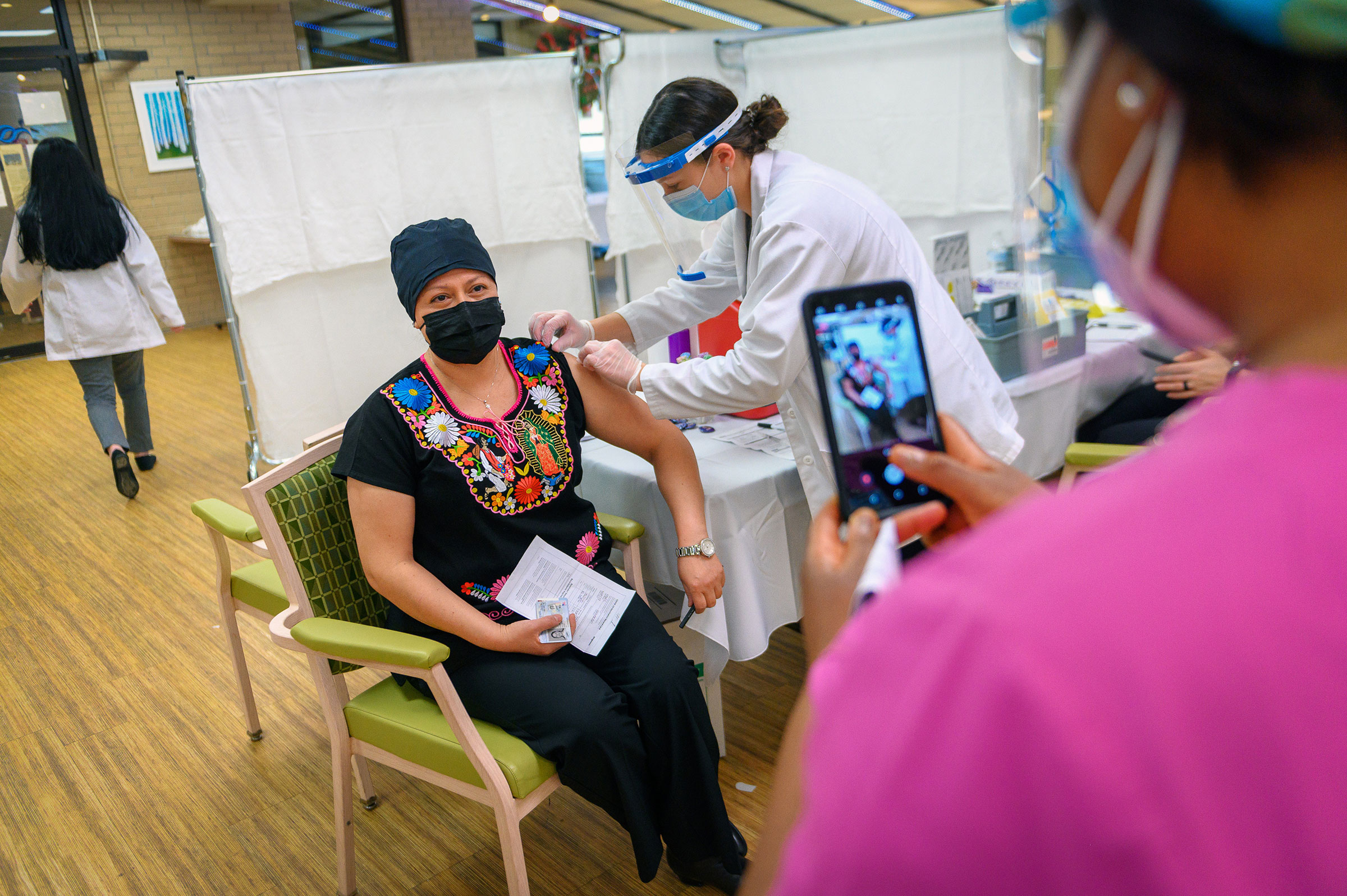 A nursing home employee receives a COVID-19 vaccine in New York, Jan. 11, 2021. (Christopher Occhicone/The New York Times)