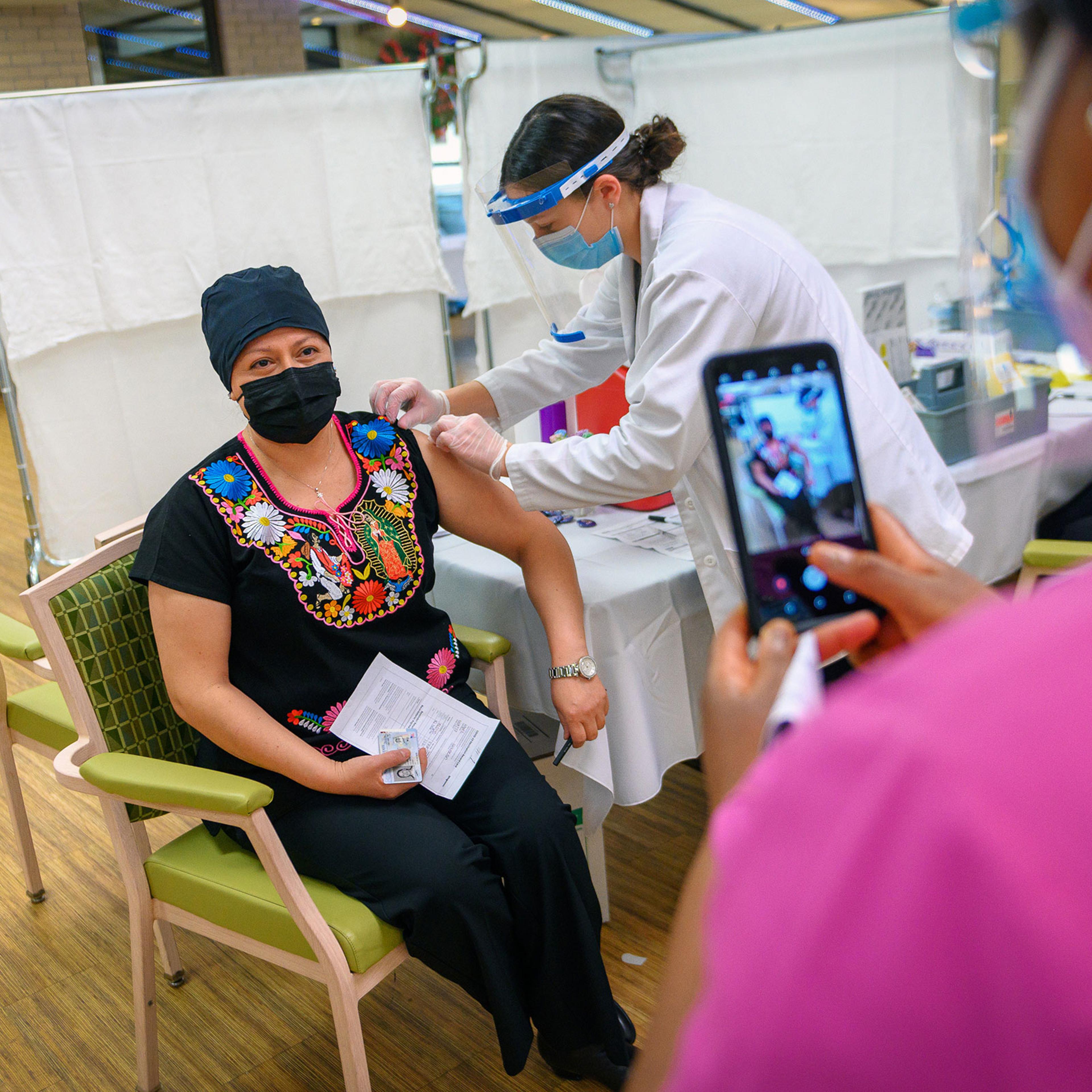 A nursing home employee receives a COVID-19 vaccine in New York, Jan. 11, 2021. (Christopher Occhicone/The New York Times)