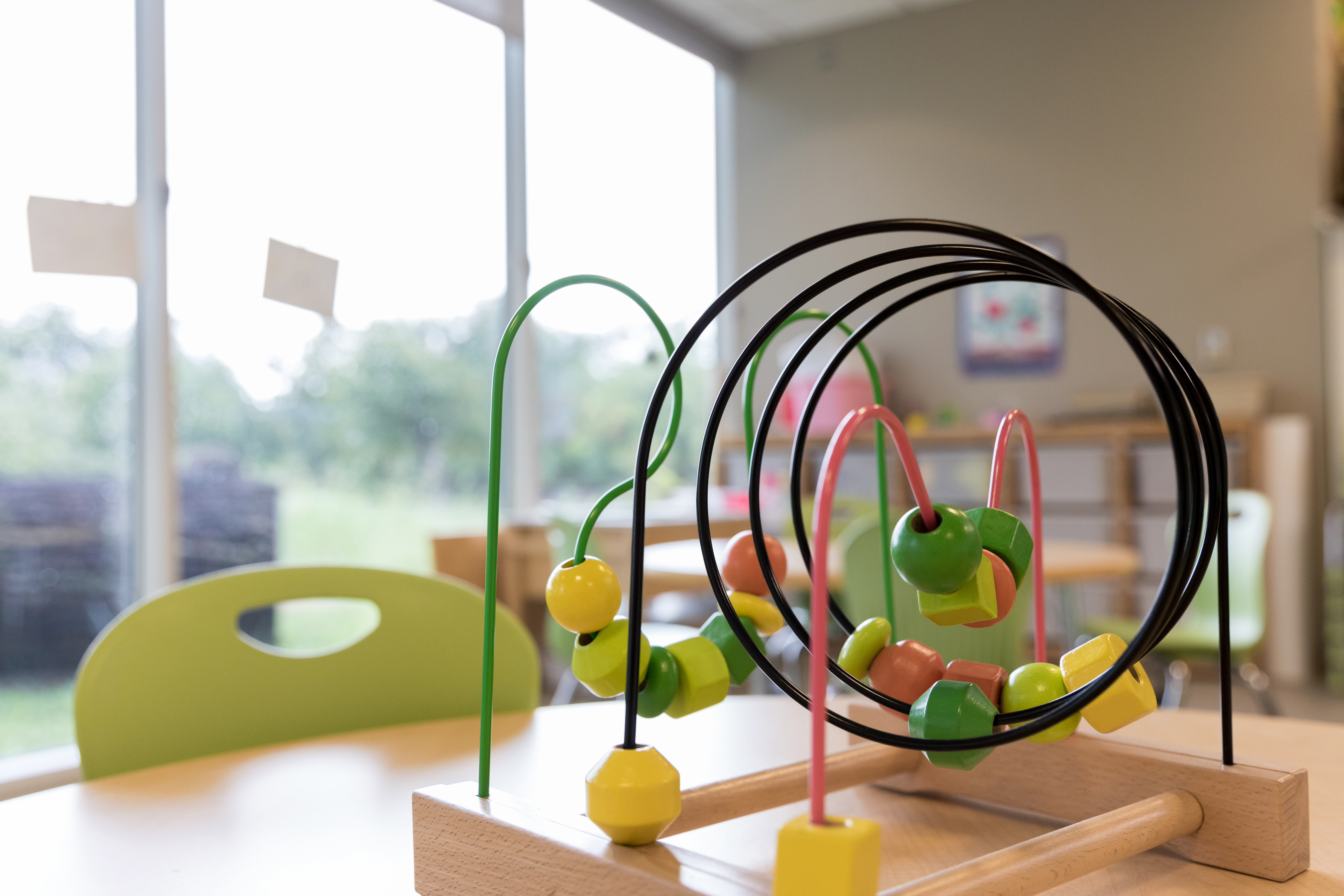Close up photo bead puzzle in empty kindergarten classroom