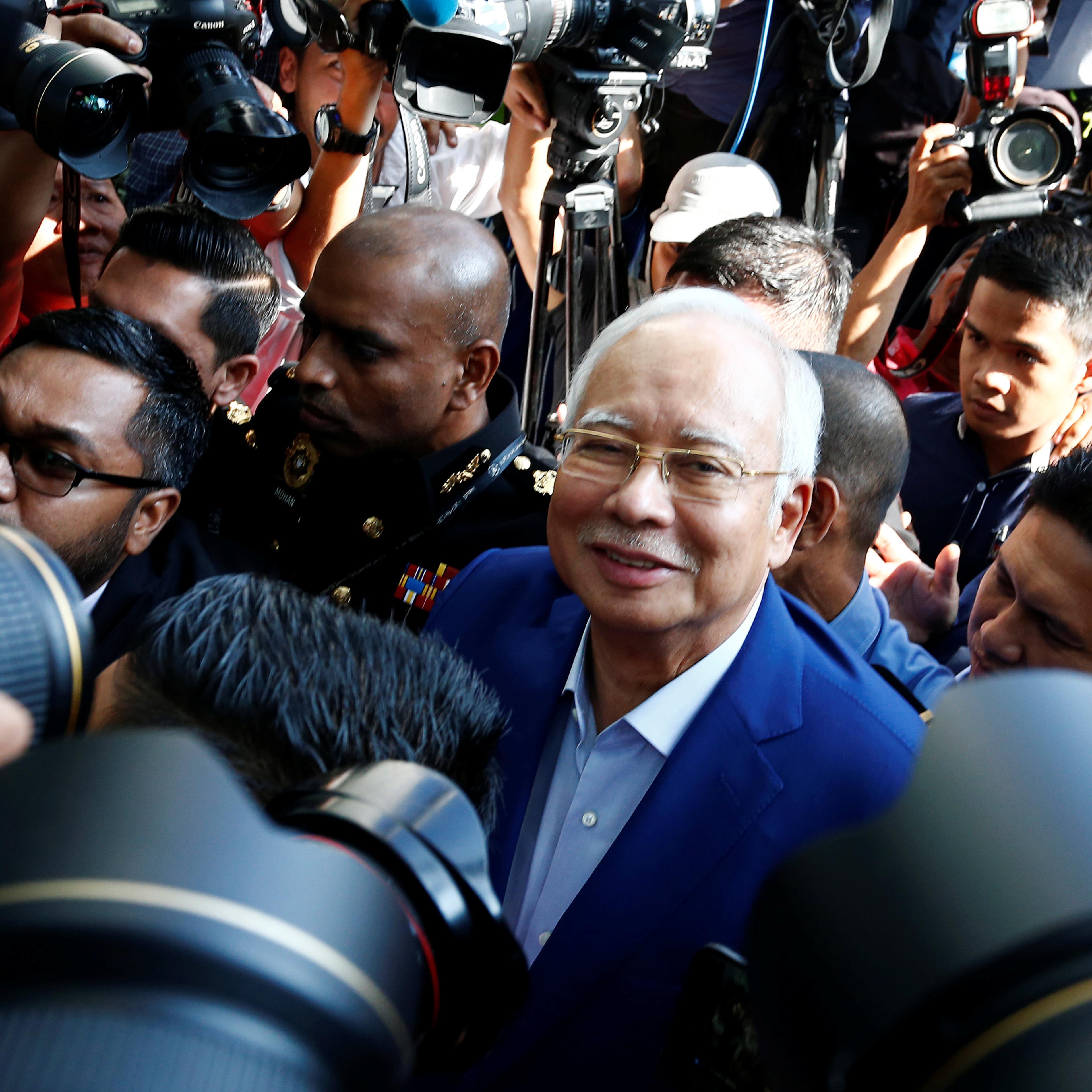 Malaysia's former prime minister Najib Razak arrives to give a statement to the Malaysian Anti-Corruption Commission (MACC) in Putrajaya