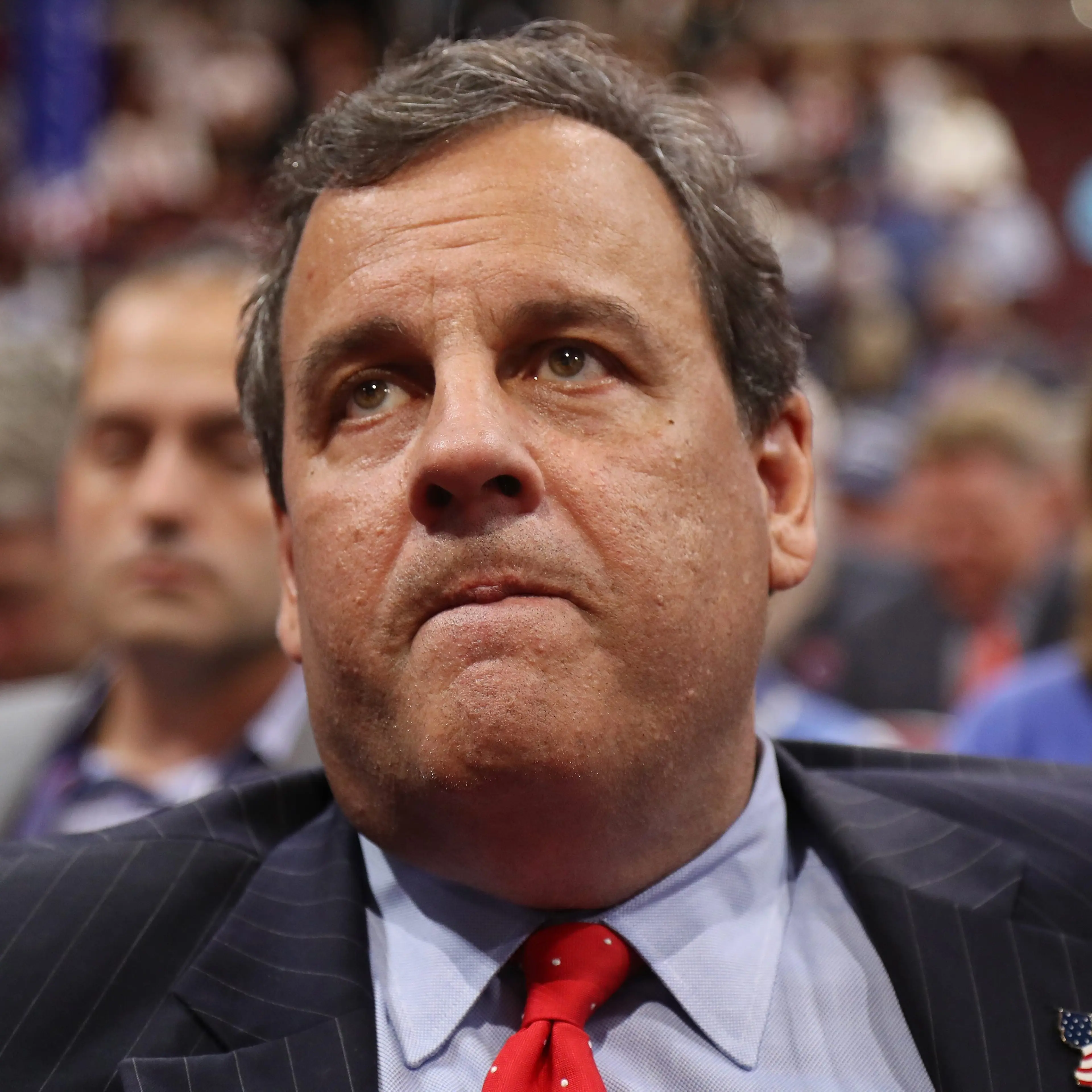 New Jersey Governor Chris Christie listens during the second session on the first day of the 2016 Republican National Convention at Quicken Loans Arena in Cleveland, July 18, 2016.