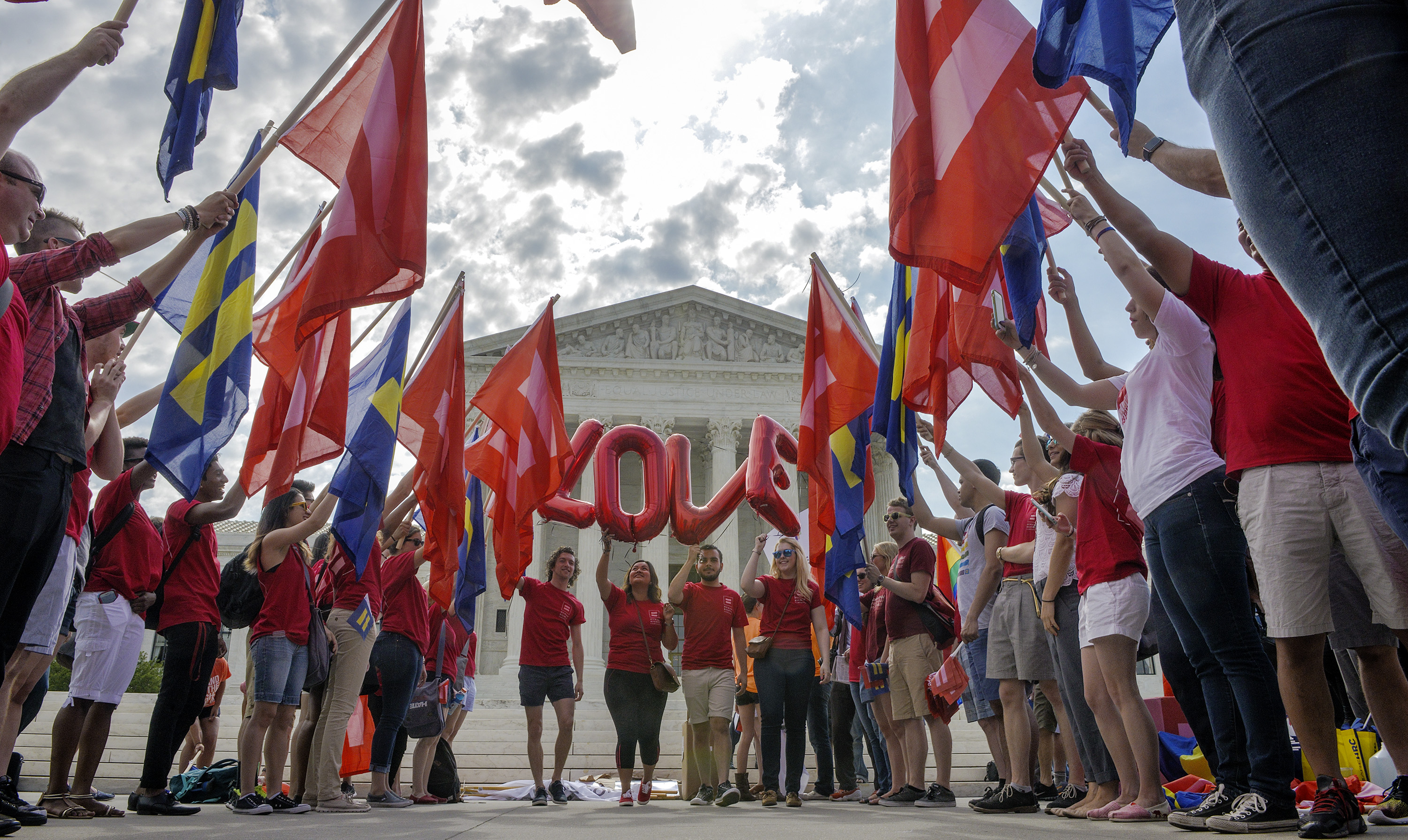 Supporters of same sex marriage rally in front of the Supreme Court awaiting a ruling to legalize gay marriage nationwide in Washington on June, 25, 2015.