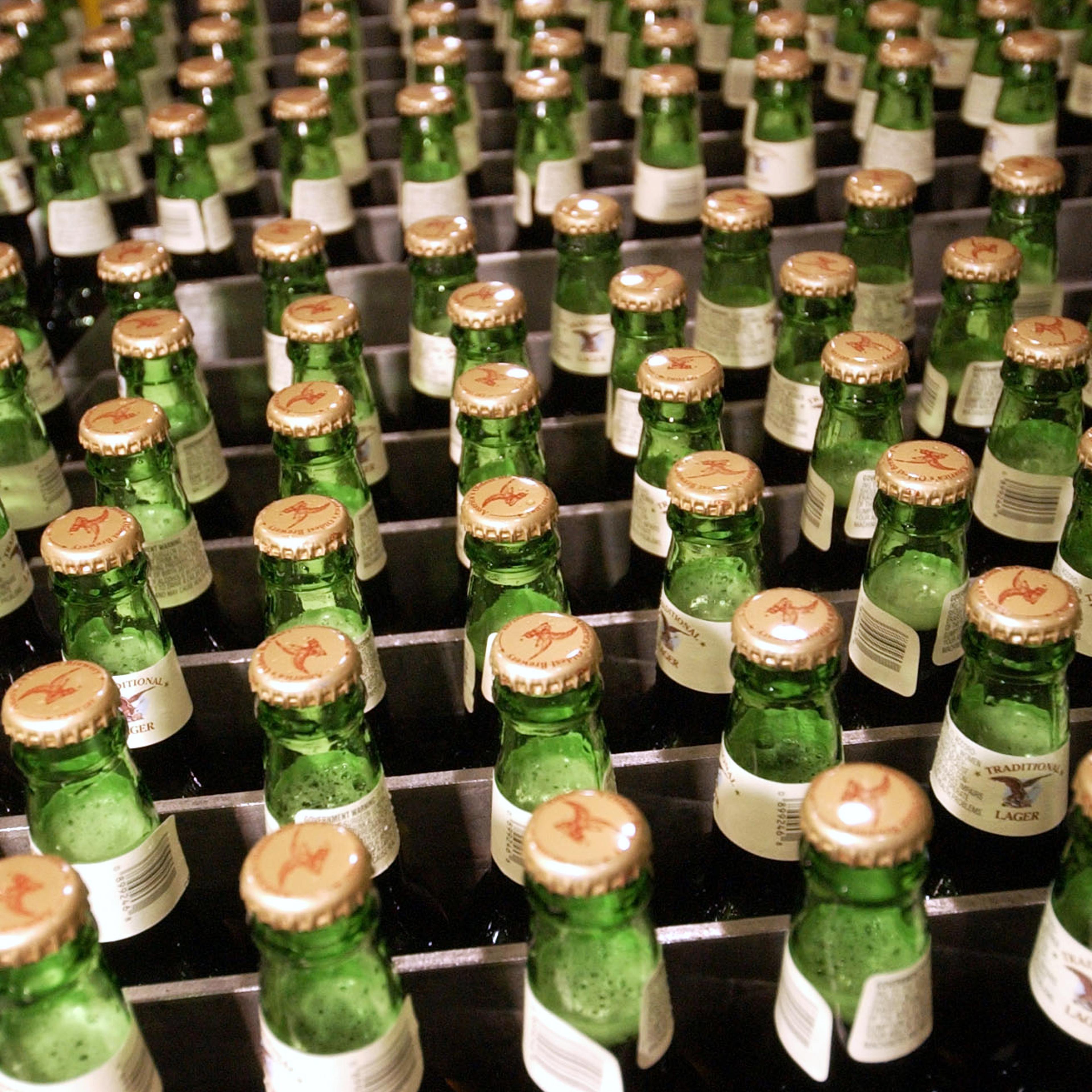 Full bottles of lager await to be loaded into cases at the Yuengling brewery in Pottsville, Pennsylvania on June 29, 2005.