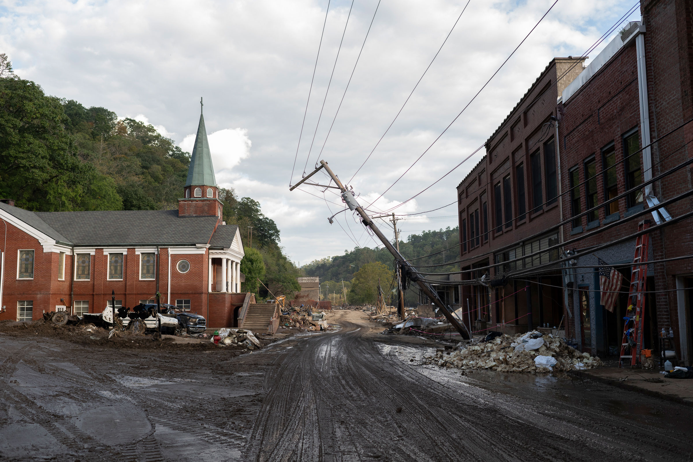 Looking south on Main Street 10 days after the storm. Rubble in the distance marks buildings that were totally destroyed in Marshall, N.C., on Oct. 3.
