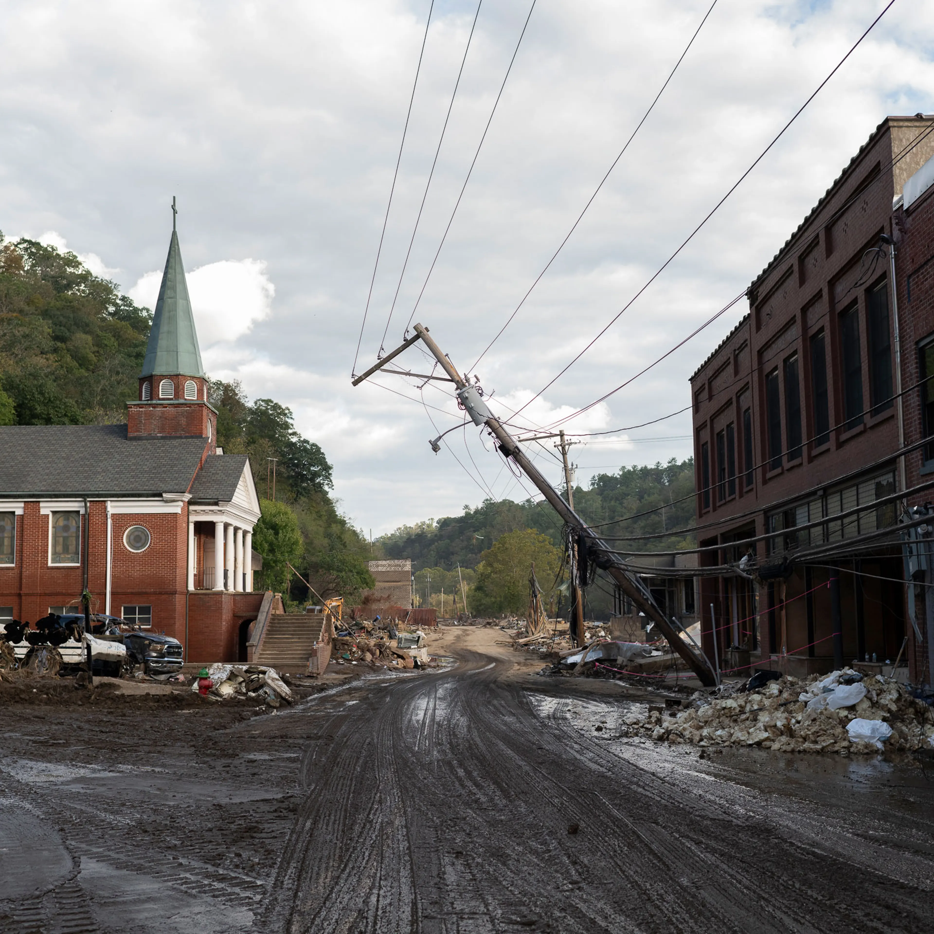Looking south on Main Street 10 days after the storm. Rubble in the distance marks buildings that were totally destroyed in Marshall, N.C., on Oct. 3.