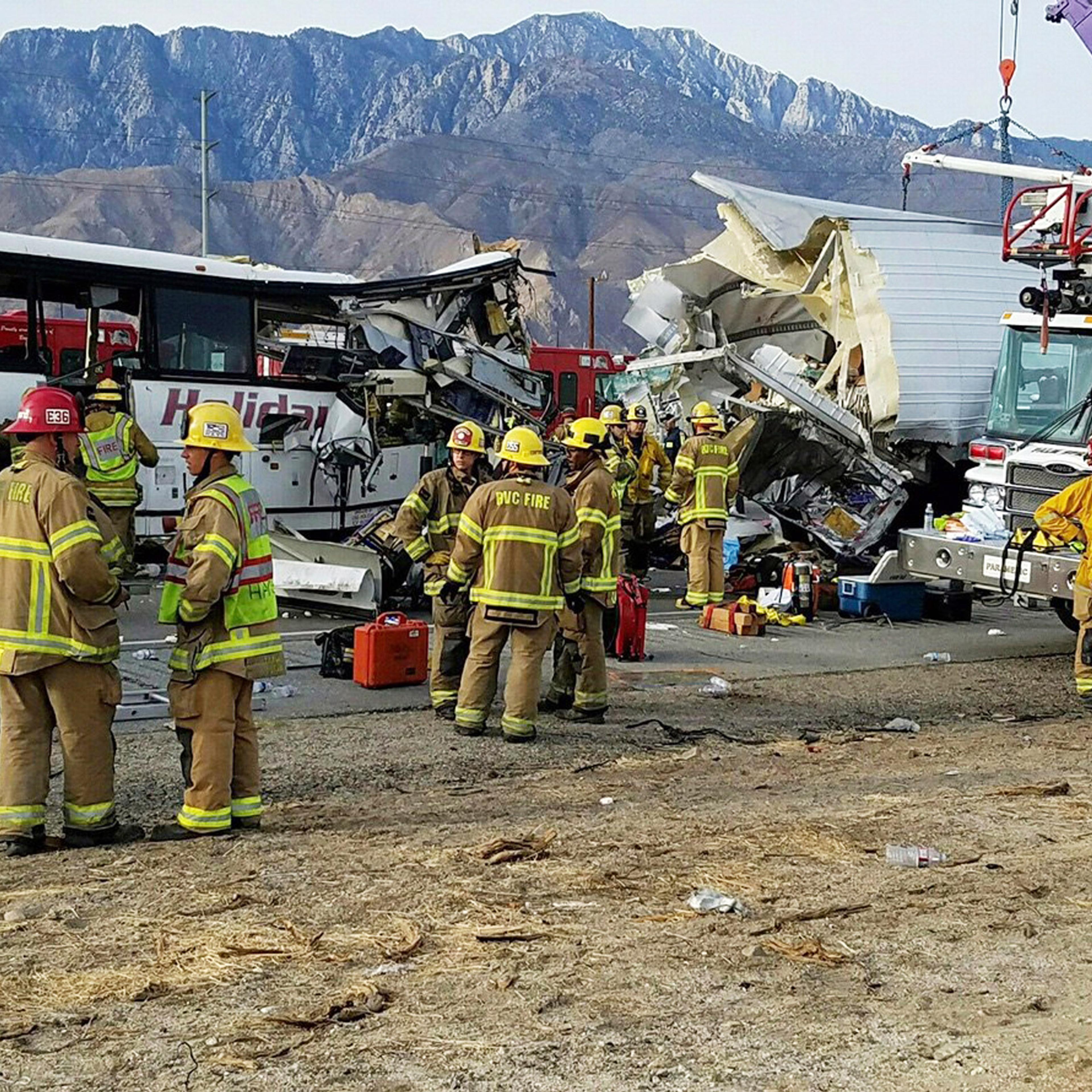 This photo provided by KMIR-TV shows the scene of crash between a tour bus and a semi-truck crashed on Interstate 10 near Desert Hot Springs, near Palm Springs, in California's Mojave Desert Sunday, Oct. 23, 2016. Multiple deaths and injuries were report