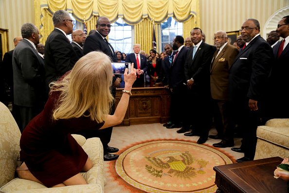Counselor to the President Kellyanne Conway takes a picture of U.S. President Donald Trump with members of the Historically Black Colleges and Universities in the Oval Office of the White House, on February 27, 2017 in Washington, DC.