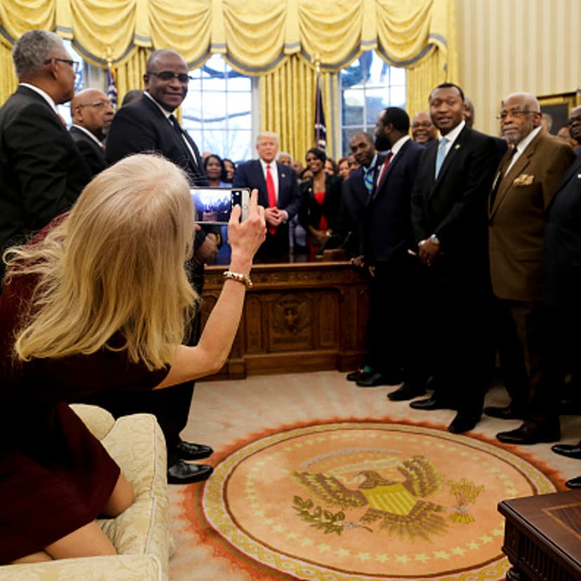 Counselor to the President Kellyanne Conway takes a picture of U.S. President Donald Trump with members of the Historically Black Colleges and Universities in the Oval Office of the White House, on February 27, 2017 in Washington, DC.