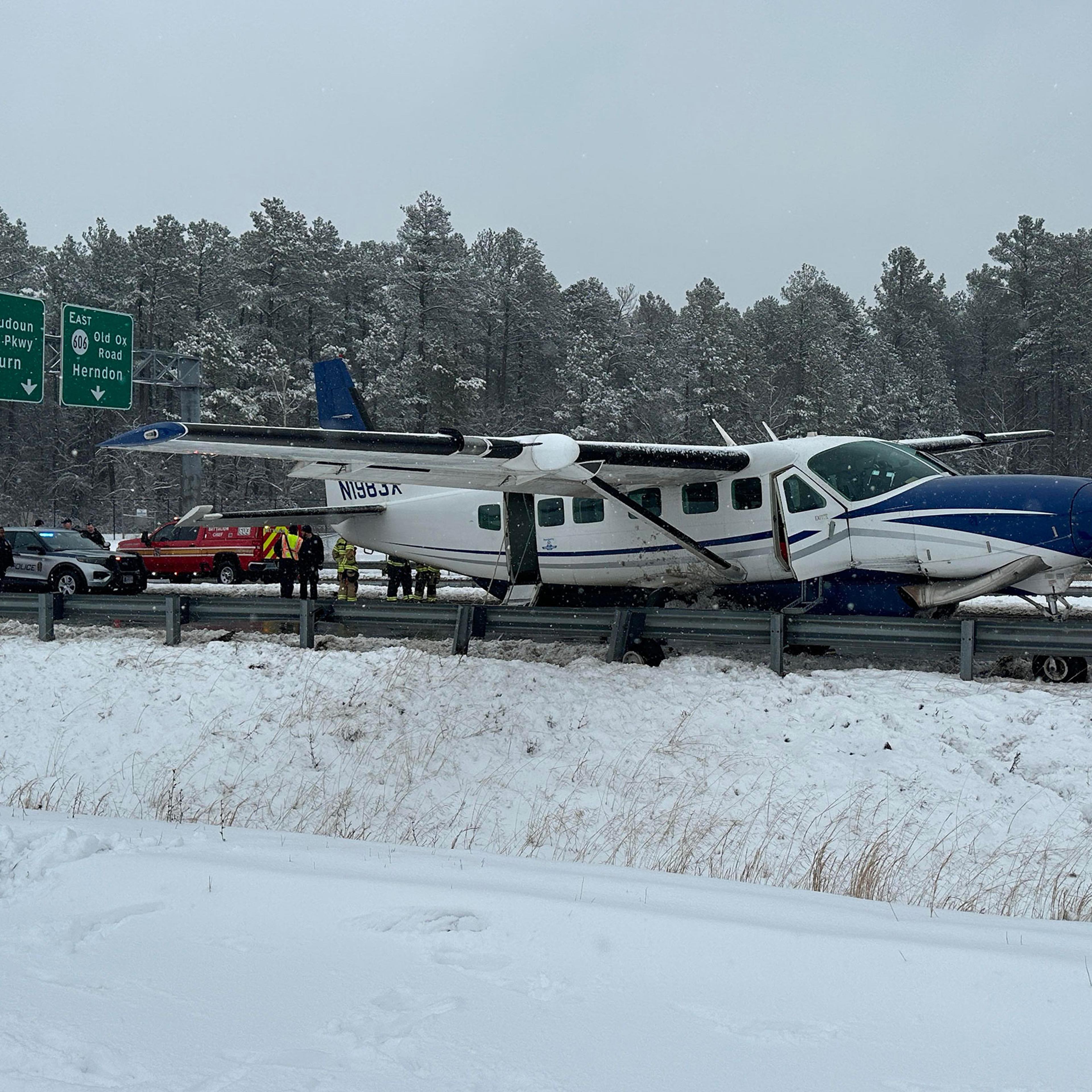 A photograph taken by a bystander showing a small aircraft after it emergency landed on a highway