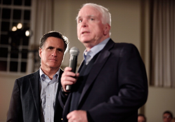 Republican presidential candidate and former Massachusetts Governor Mitt Romney (L) and former presidential nominee U.S. Sen. John McCain (R-AZ) hold a campaign town hall meeting at the Peterborough Town House January 4, 2012 in Peterborough, New Hampshi