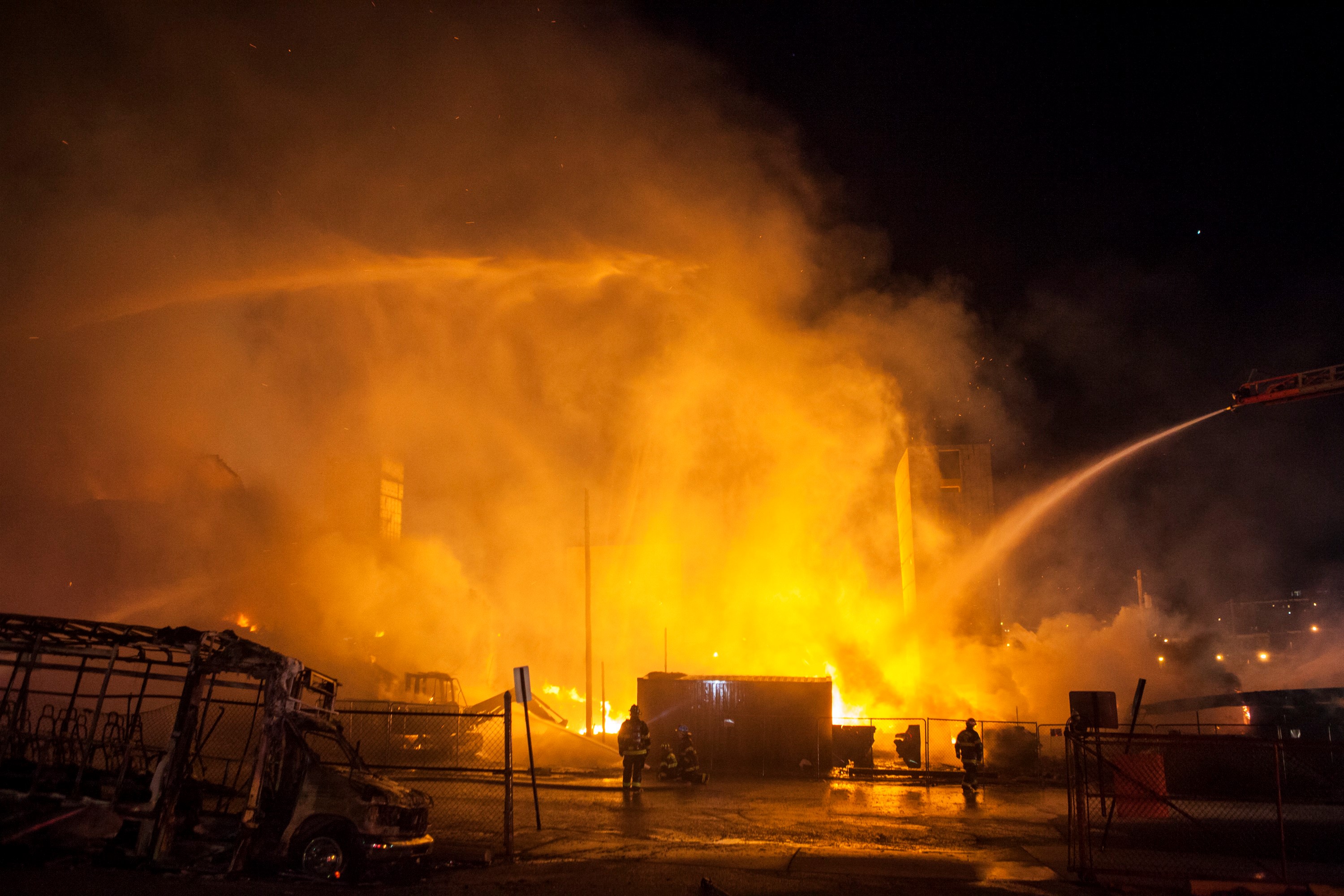 BALTIMORE, USA - APRIL 27: Fire Fighter attempt to put out a building that was set on fire during riots in Baltimore, on April 27, 2015. Protests following the death of Freddie Gray from injuries suffered while in police custody have turned violent.
