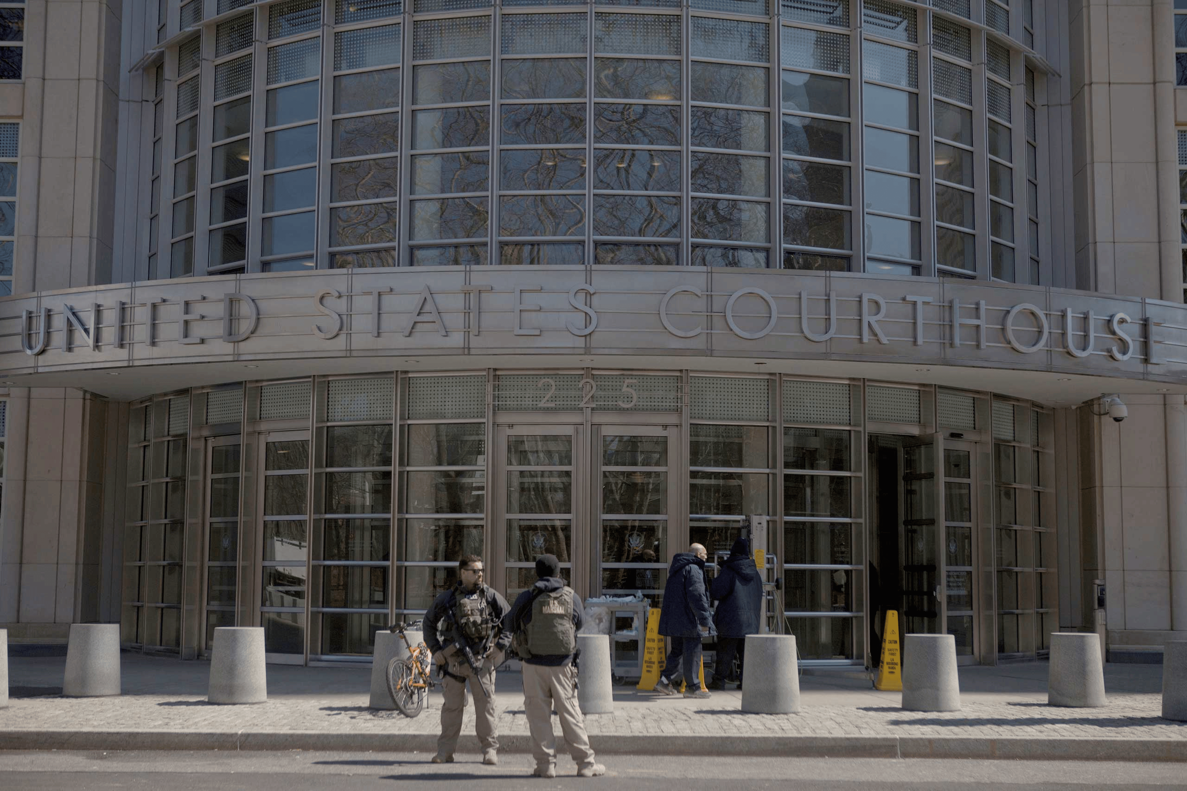 U.S. Marshals stand outside U.S. Federal Court in Brooklyn during the arraignment on terrorism charges of two Queens women in New York City on April 2, 2015.