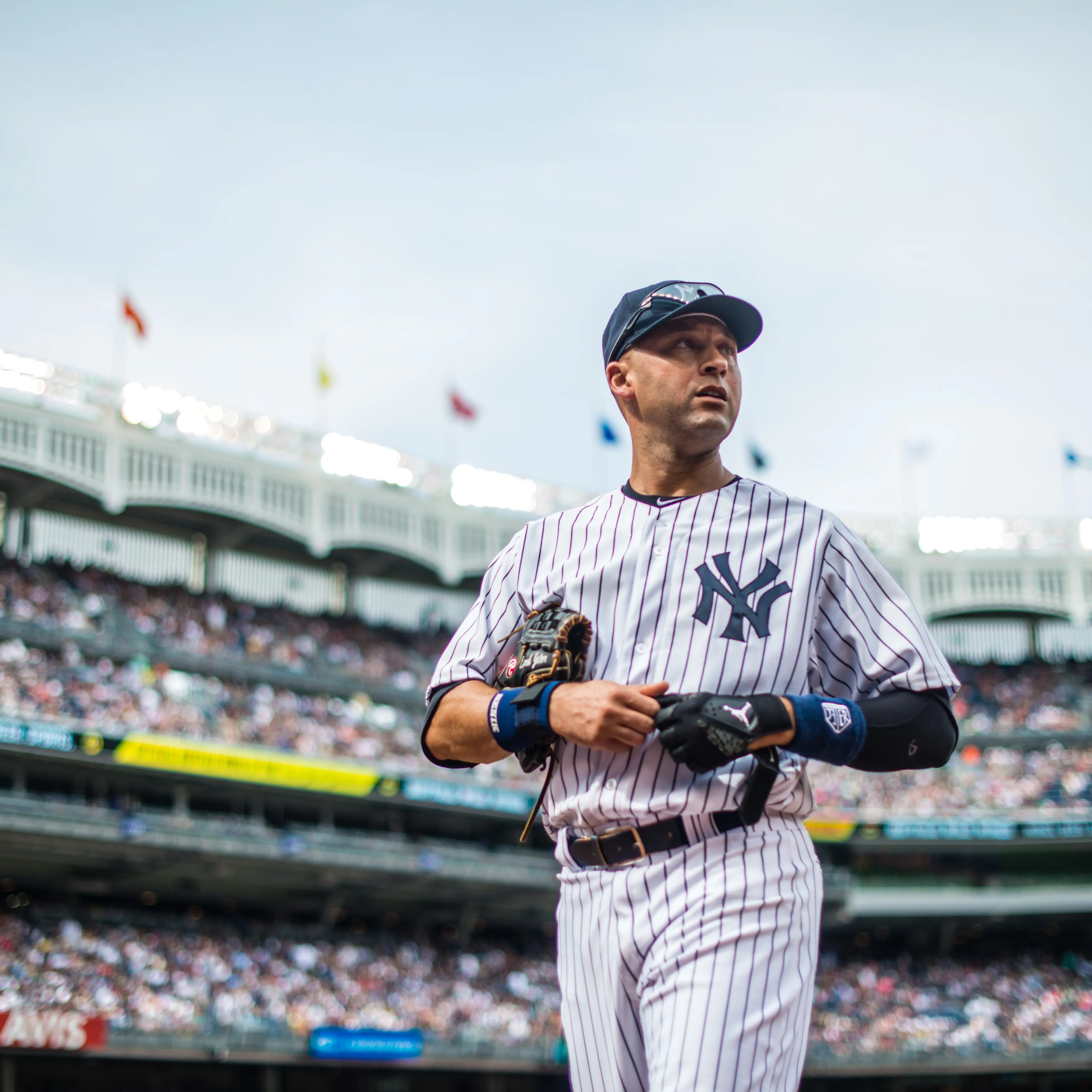 Derek Jeter of the New York Yankees looks on while walking back to the dugout during the game against the Tampa Bay Rays at Yankee Stadium on July 28, 2013 in the Bronx borough of New York City.