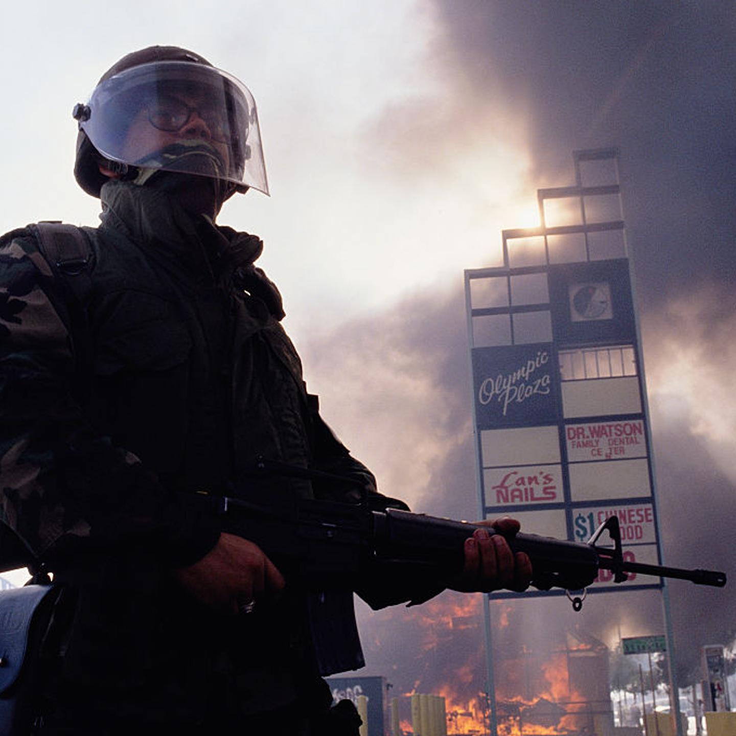 Guardsman Standing near Burning Building