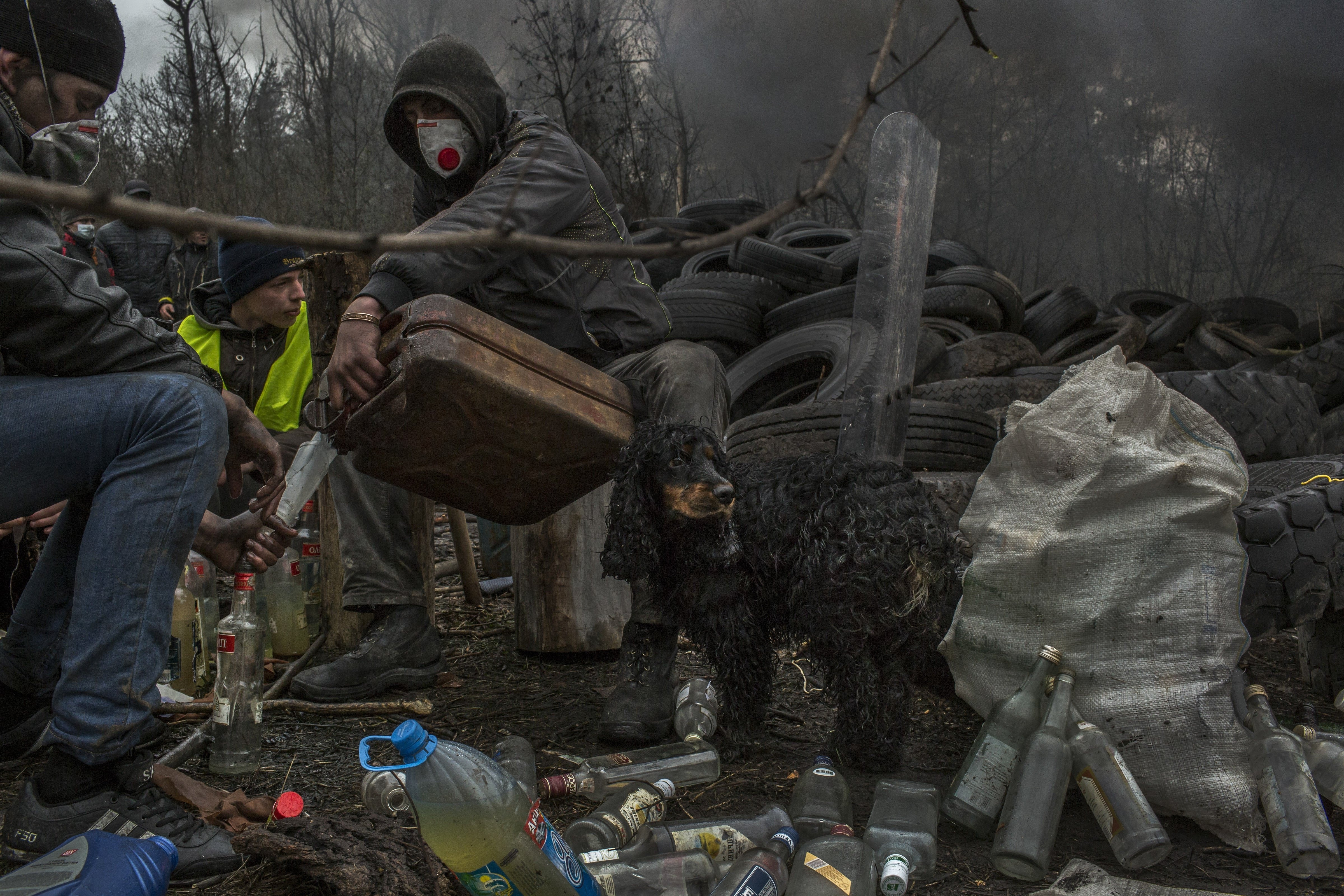 Cheers to Moscow Pro-Russian protesters make Molotov cocktails in Solvyansk, in eastern Ukraine