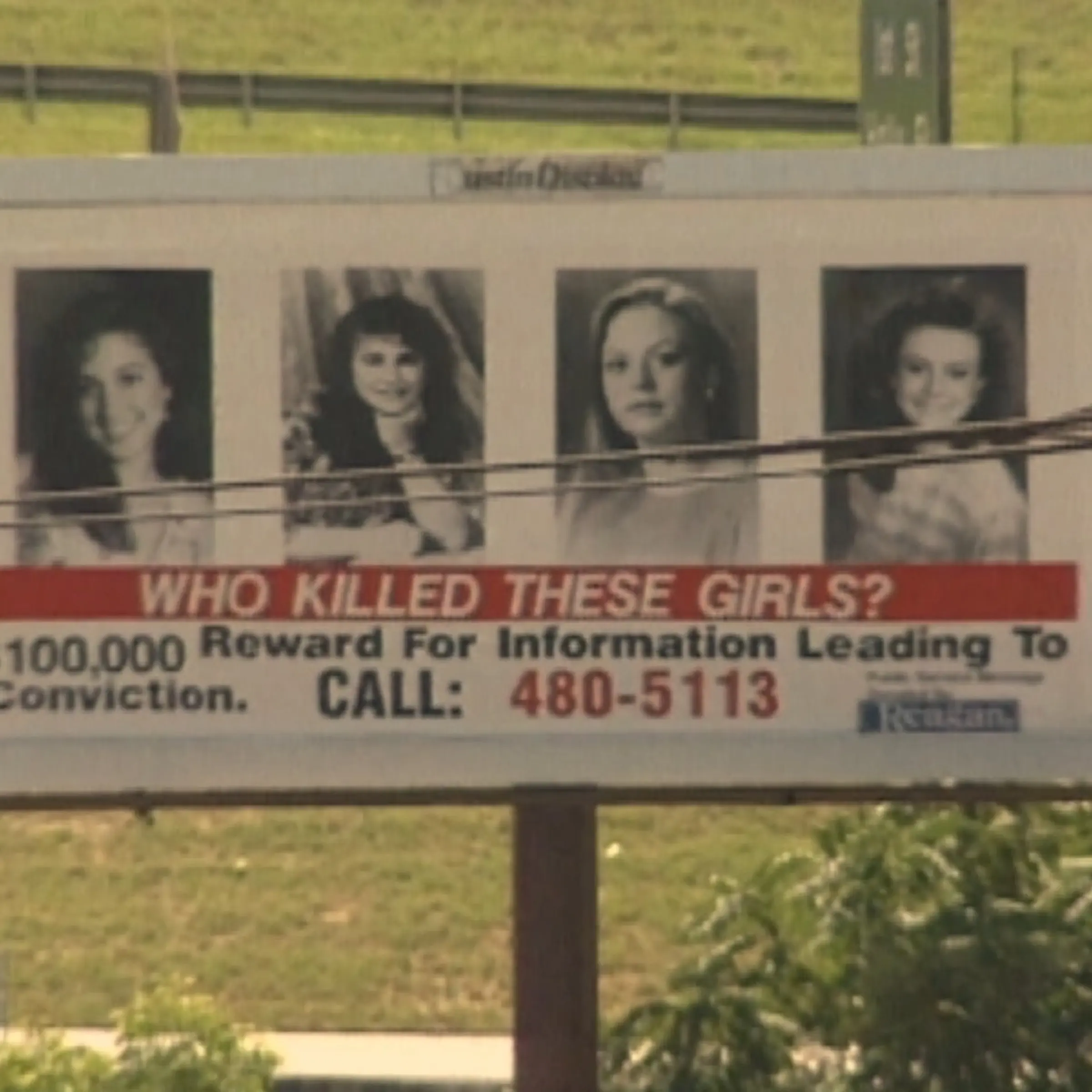 A billboard advertises a $100,000 reward for anyone who reports the person who murdered four girls in an I Can't Believe It's Yogurt! shop in Austin, Texas, on Dec. 6, 1991.