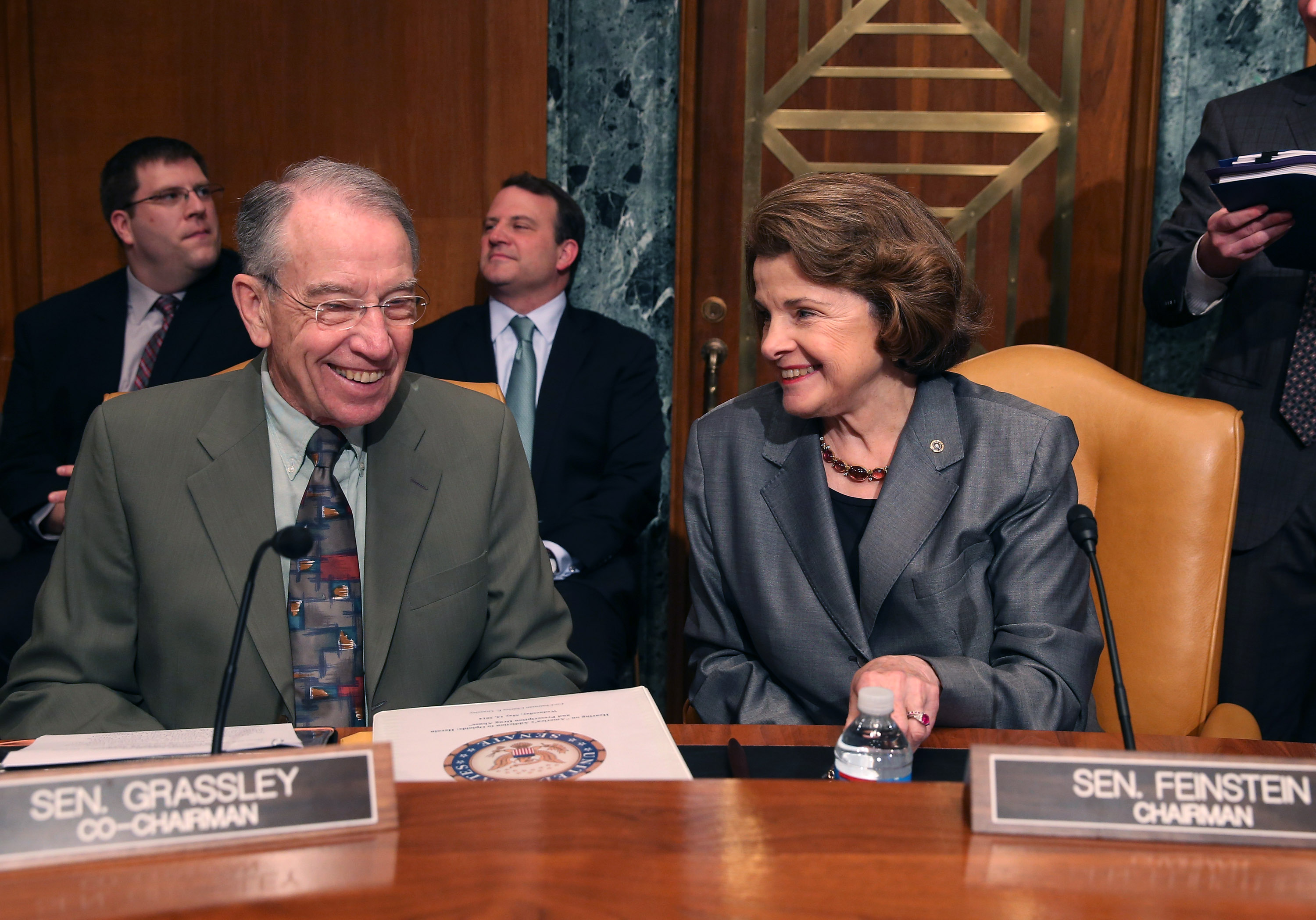 U.S. Sen. Dianne Feinstein (D-CA) (R) and U.S. Sen. Chuck Grassley (R-IA) talk during s Senate Caucus on International Narcotics Control hearing on Capitol Hill in Washington, DC, on May 14, 2014.